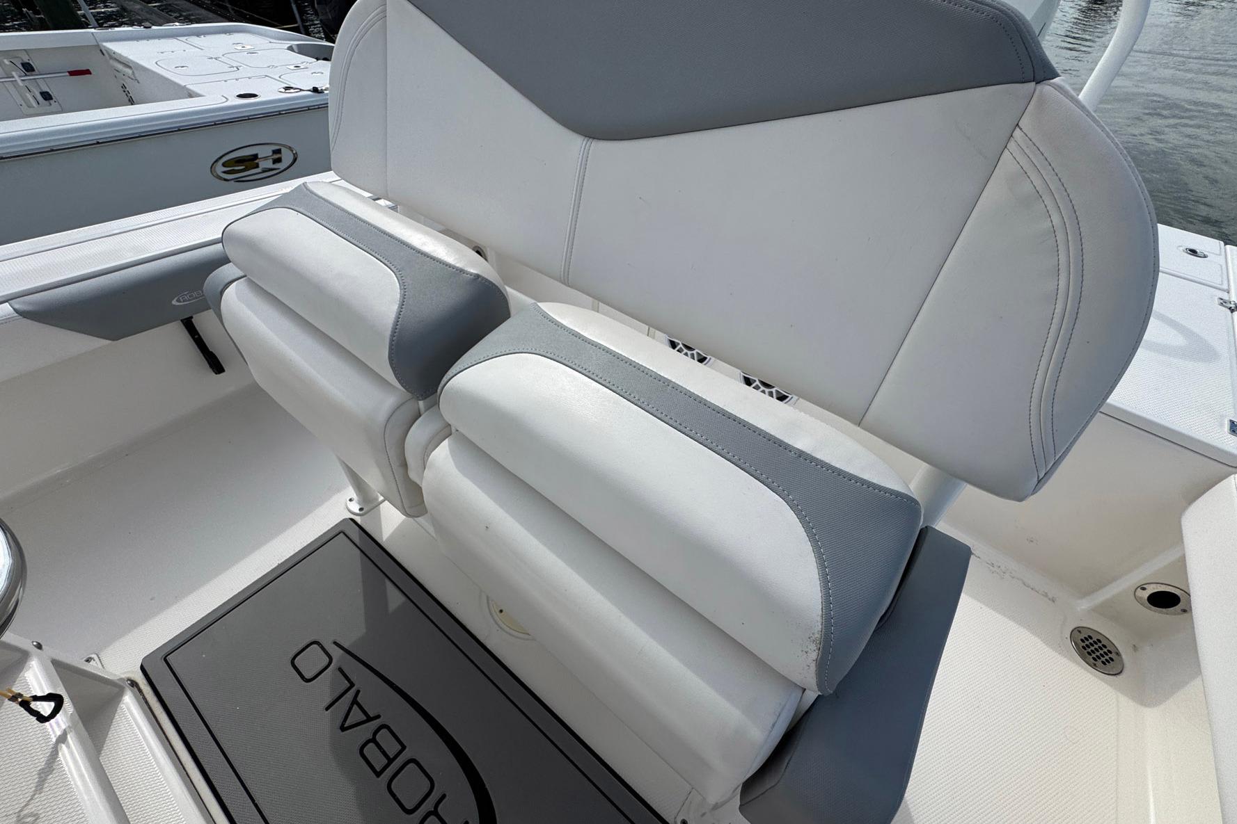 2021 Robalo 246 Cayman boat seating with gray and white upholstery.