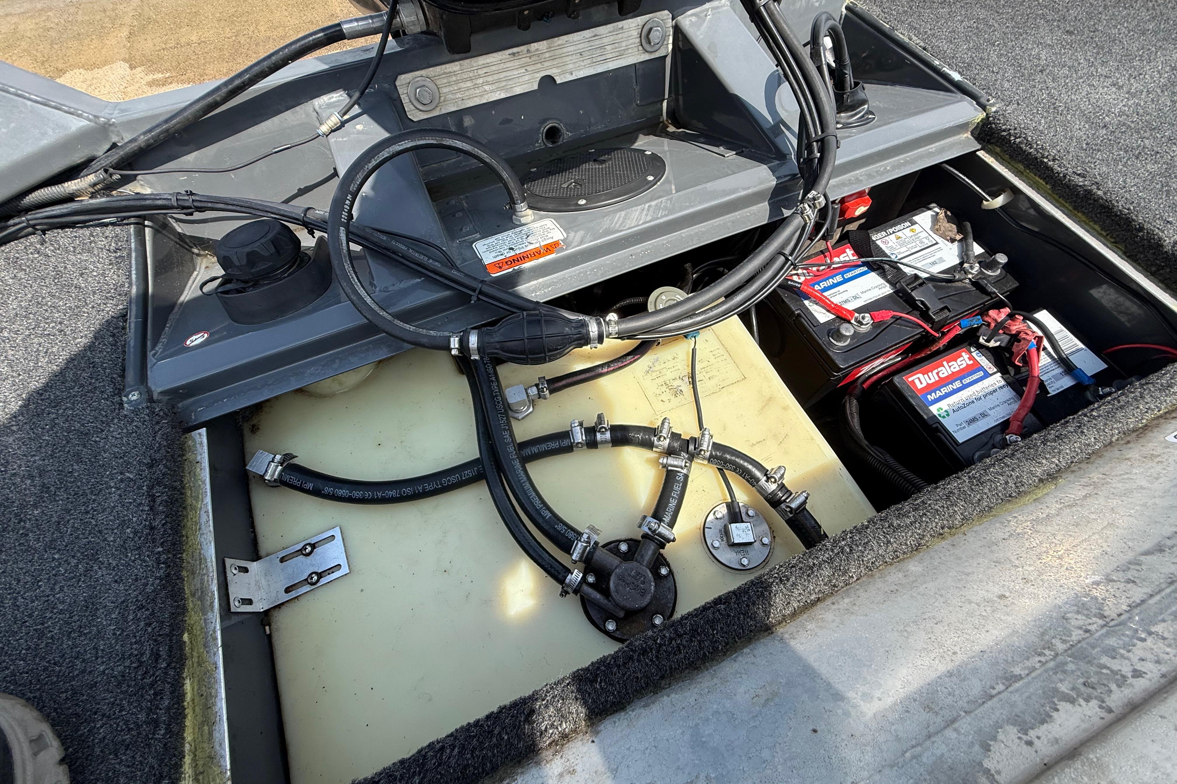 2015 Tracker Pro Team 190 TX boat battery compartment with wiring and components.