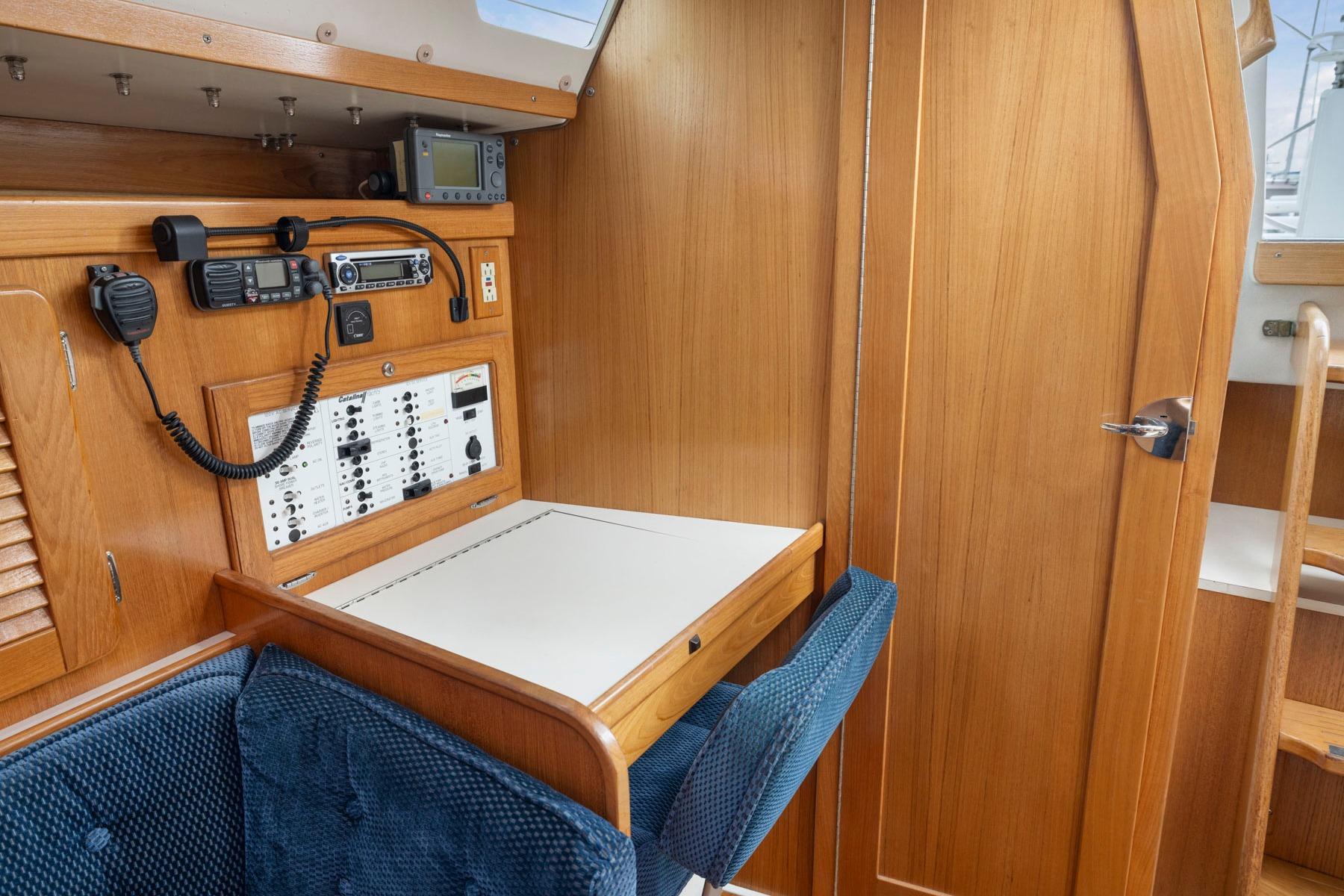 Navigation station in a 2004 Catalina 36 MkII sailboat with communication equipment.