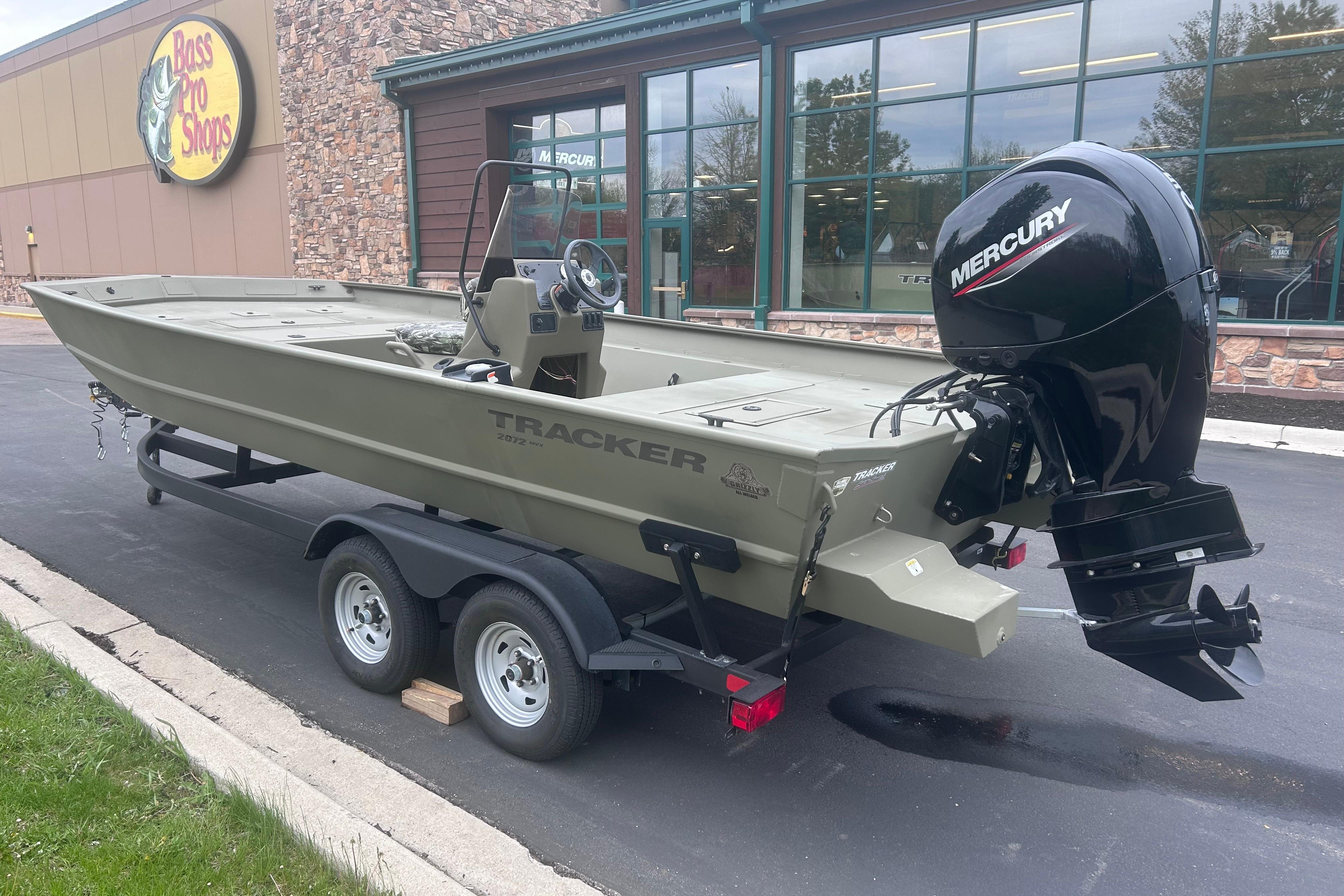 2024 Tracker Grizzly 2072 CC boat with Mercury engine outside Bass Pro Shops.