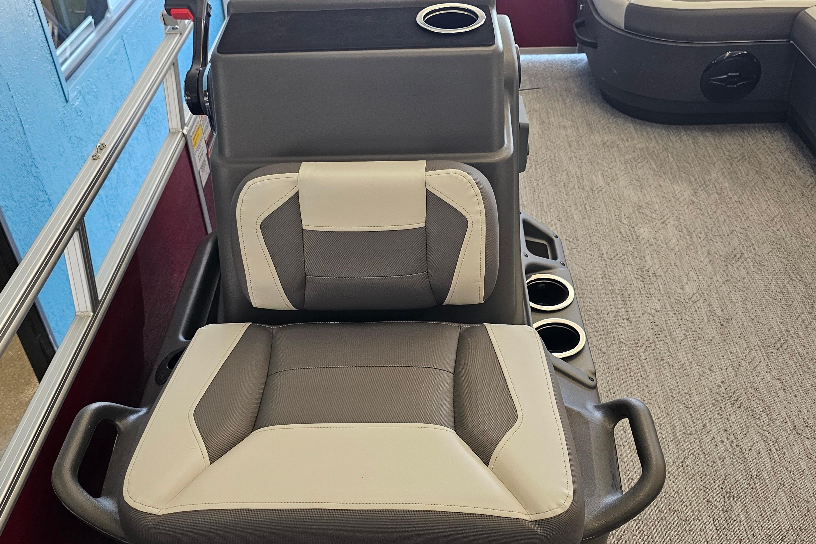 2026 Sun Tracker Bass Buggy 16 XL Select boat seat with cup holders and armrests.