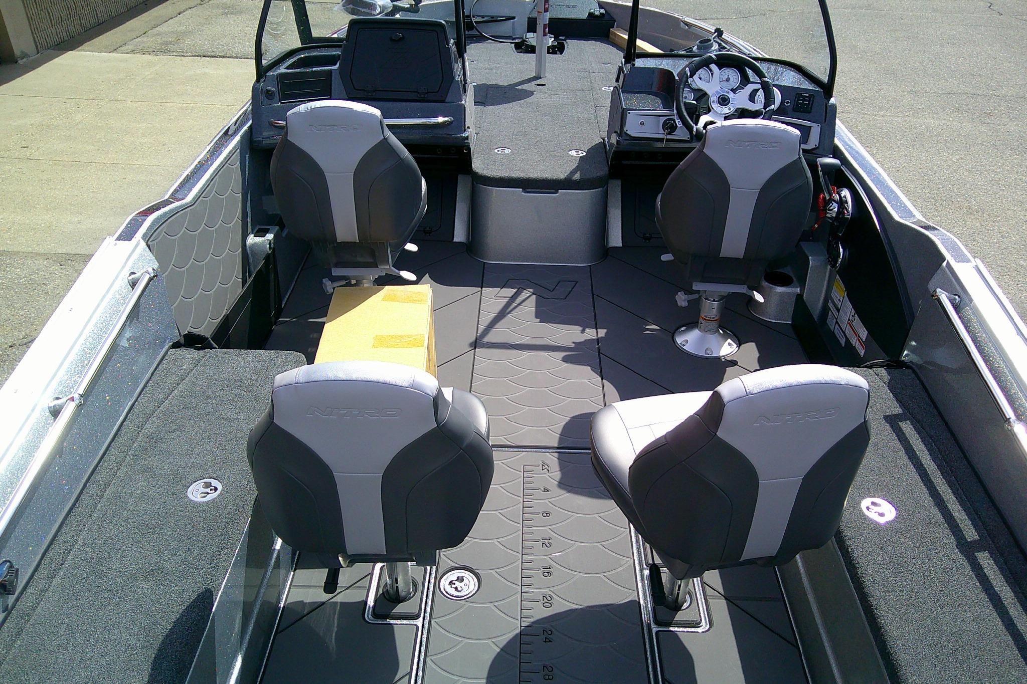 Interior of 2026 Nitro ZV21 Pro boat with four seats and modern dashboard.