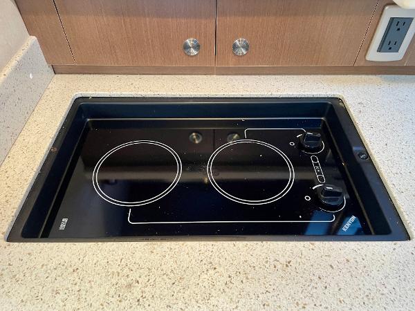 Built-in stovetop on 2014 Sea Ray 330 Sundancer yacht kitchen counter.