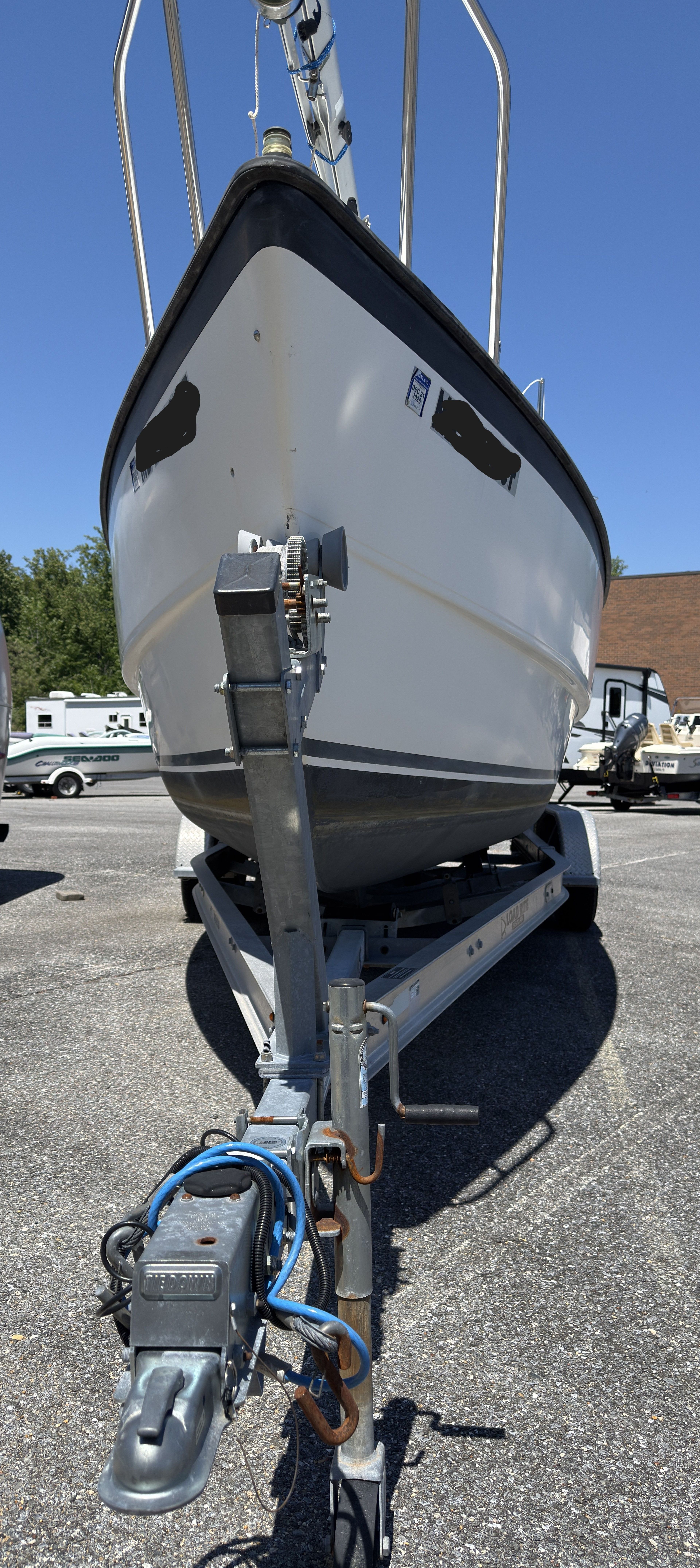 1997 MacGregor 26X sailboat on trailer, close-up of bow.