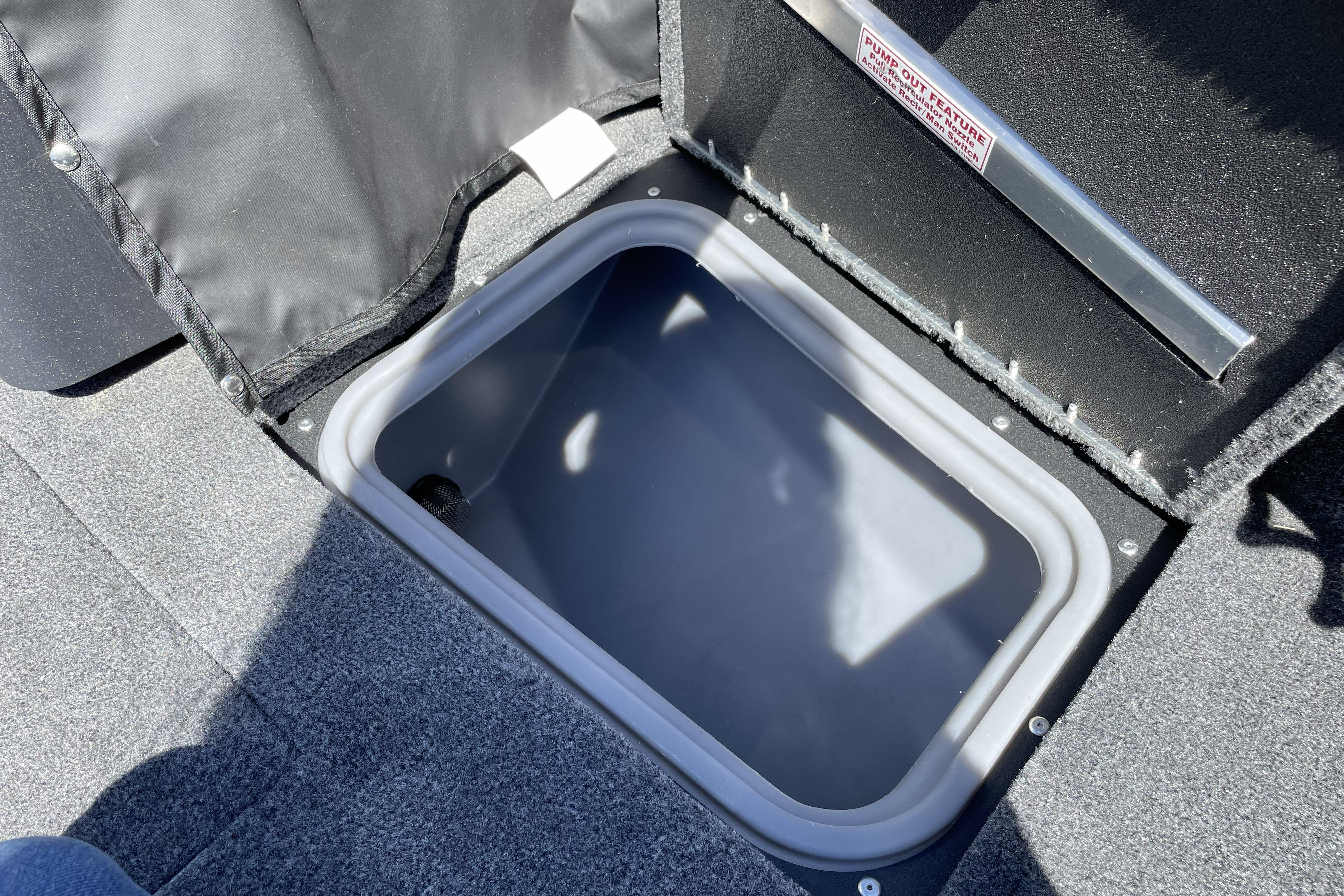 Storage compartment in 2026 Tracker Targa V-18 WT boat, featuring durable interior design.