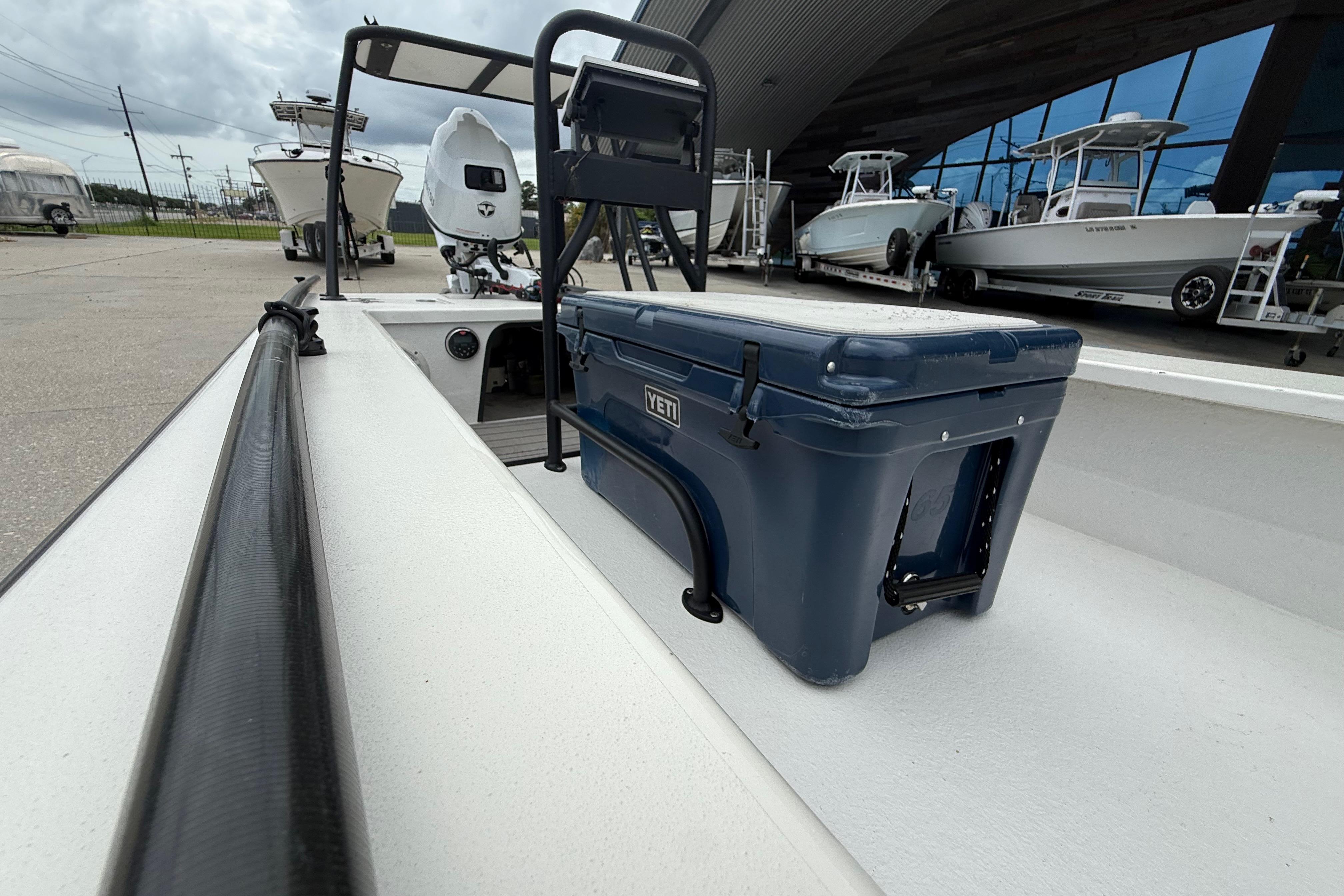 2020 Skimmer Skiff 14 boat with YETI cooler, docked near other boats.