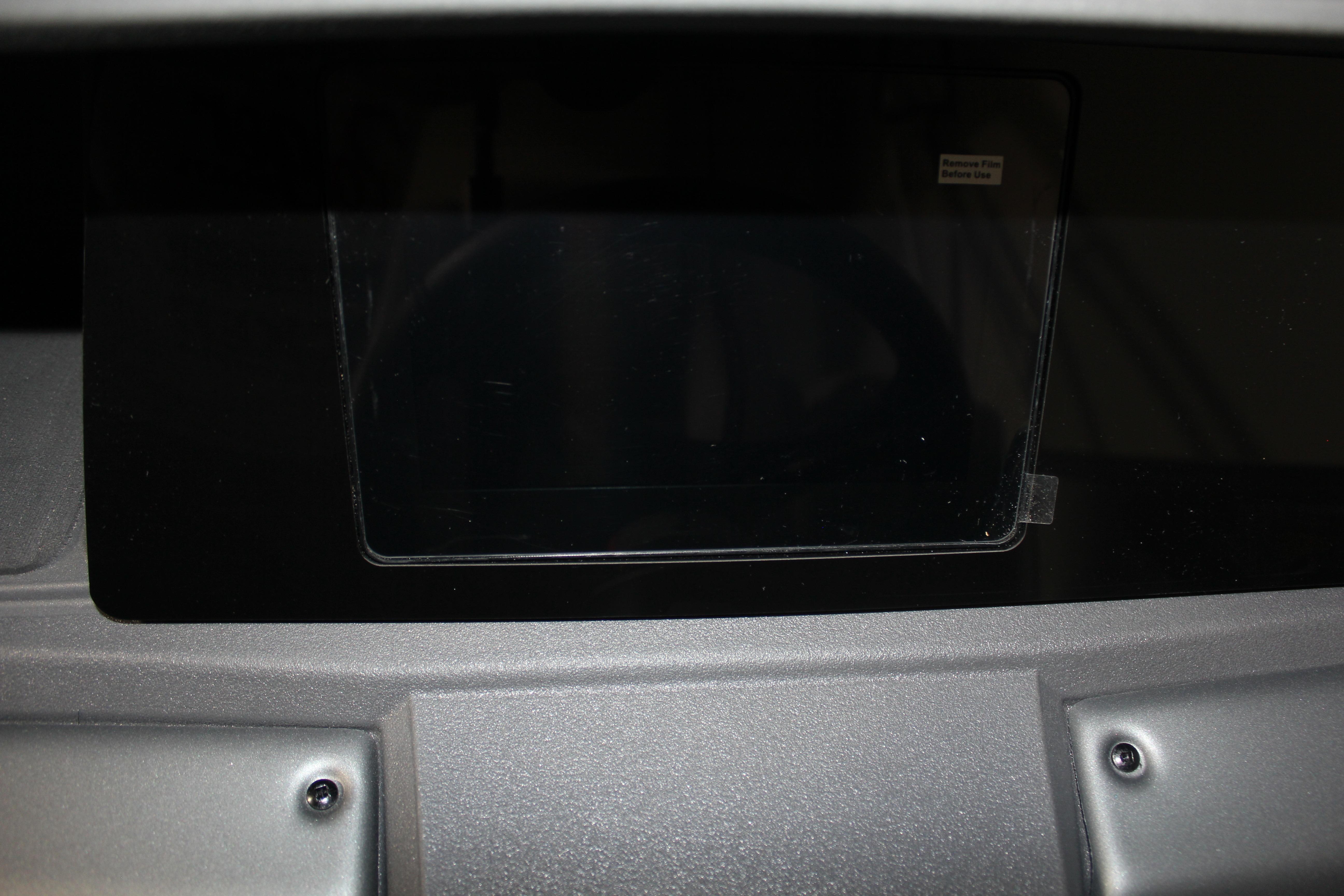 Dashboard of 2026 Sun Tracker Party Barge 22 DLX boat, featuring a central display.