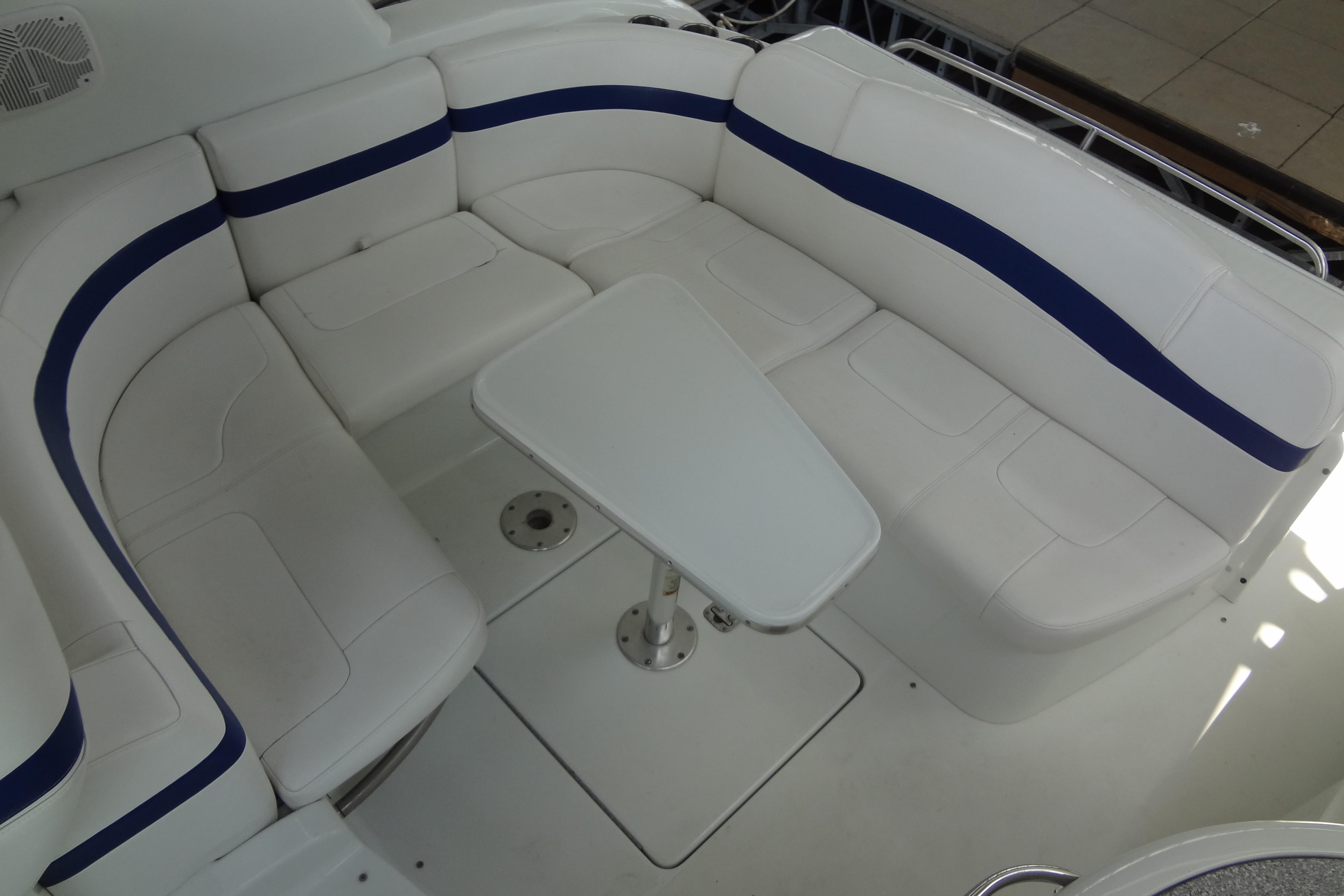 2007 Formula 34 Performance Cruiser interior with white and blue seating and table.