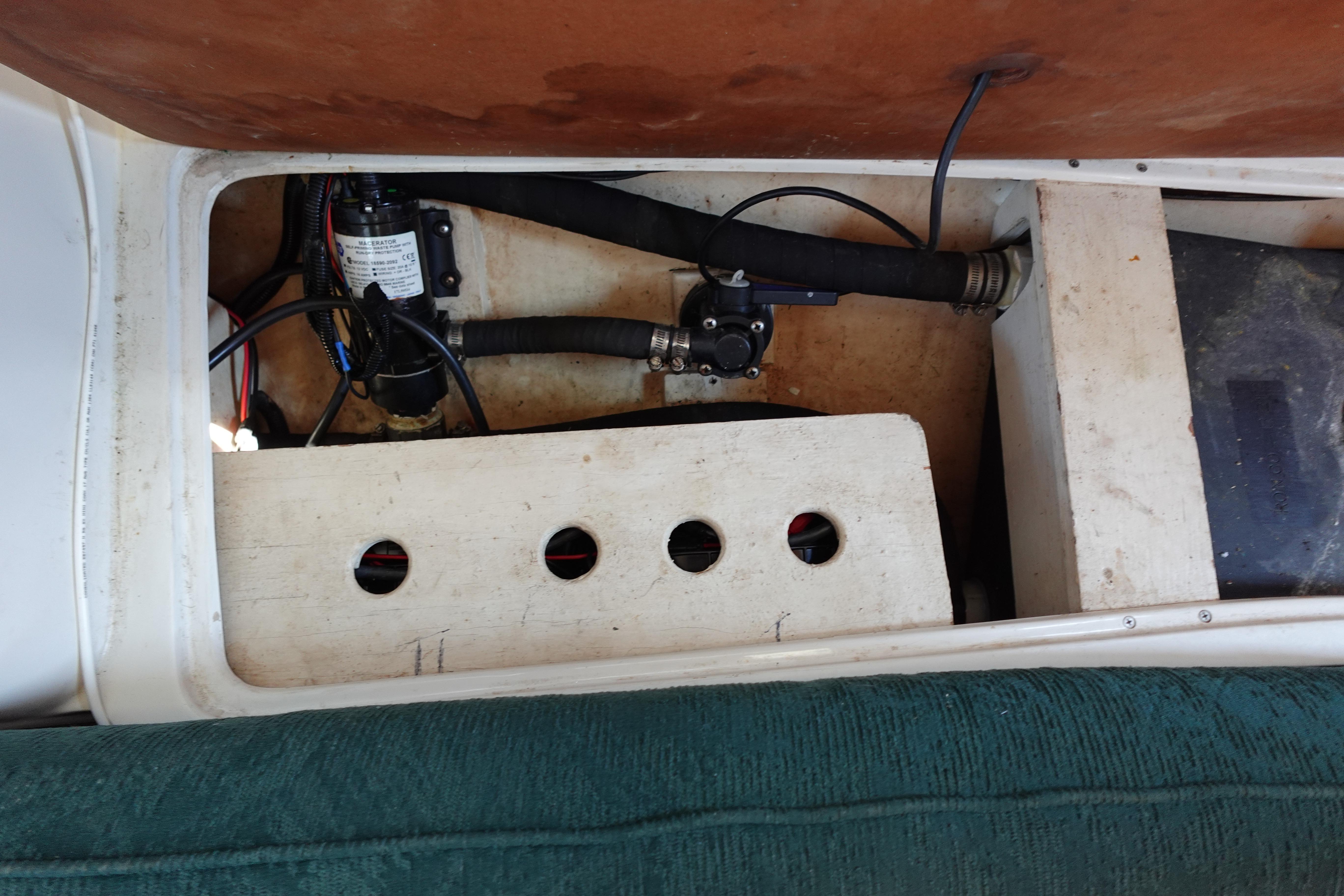 1997 Catalina 28 boat interior showing mechanical components and wiring.