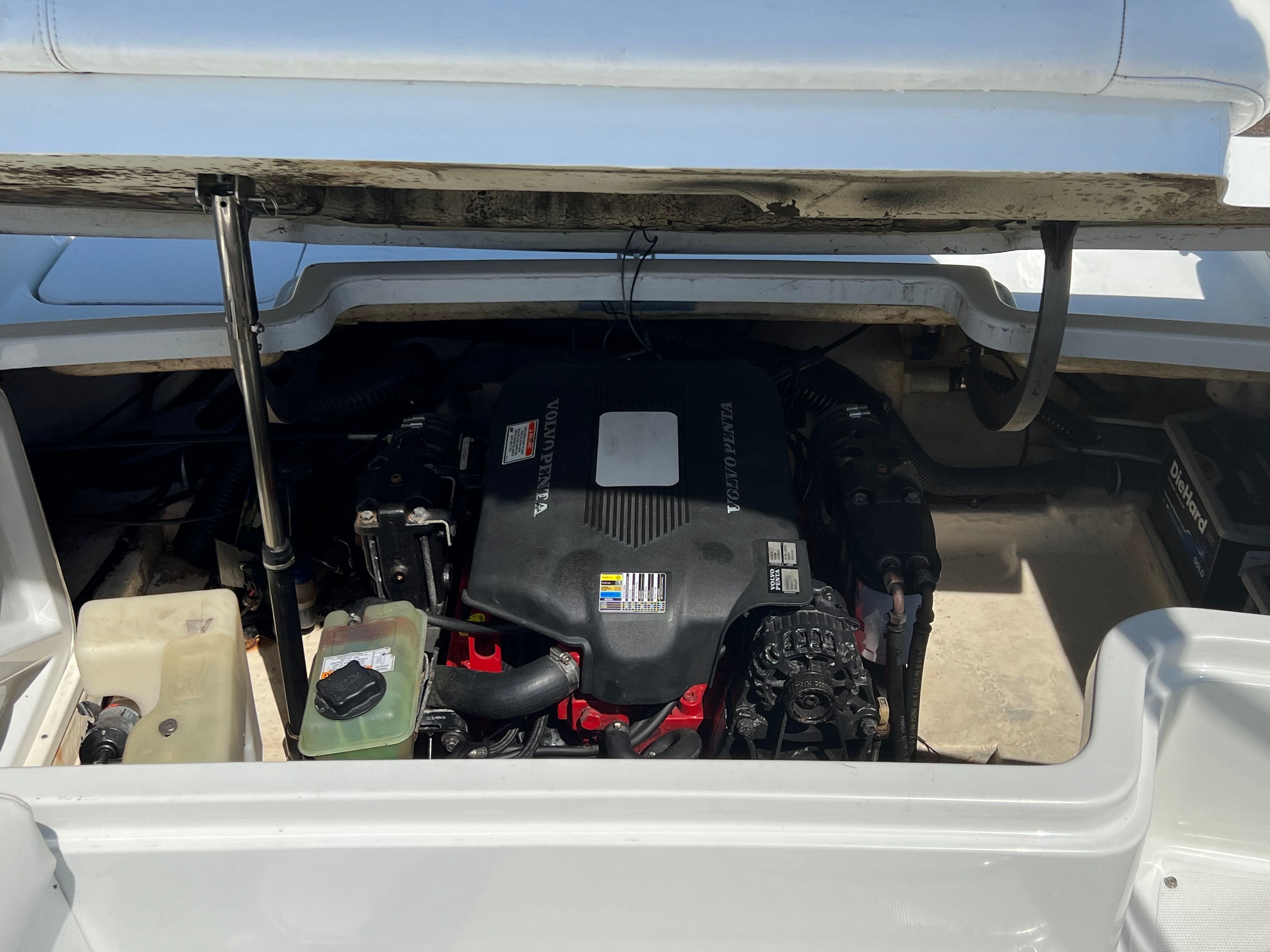 The engine compartment of a 2005 Formula 260 Sun Sport boat with a prominently visible engine.