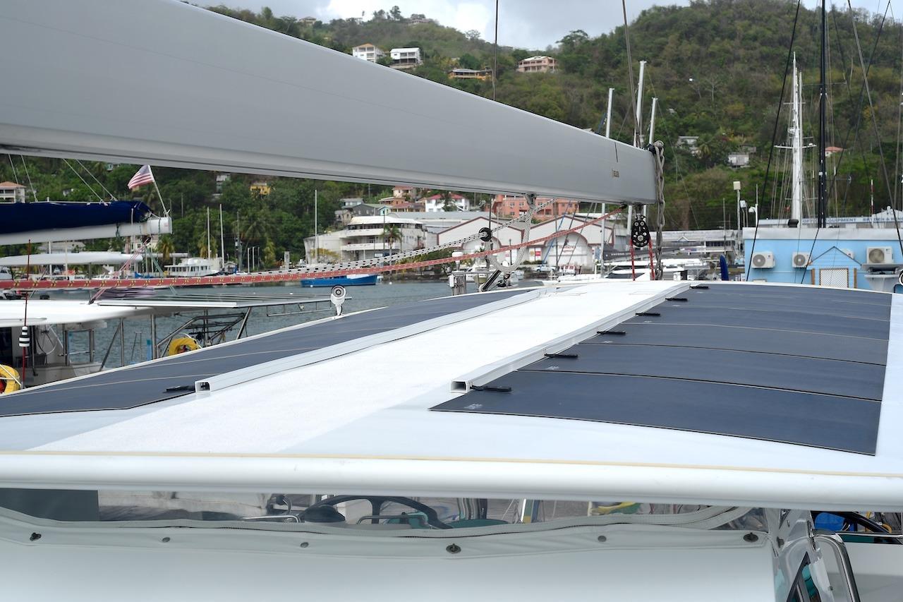 Sailboat Hylas 63 (2017) with solar panels docked in a marina.