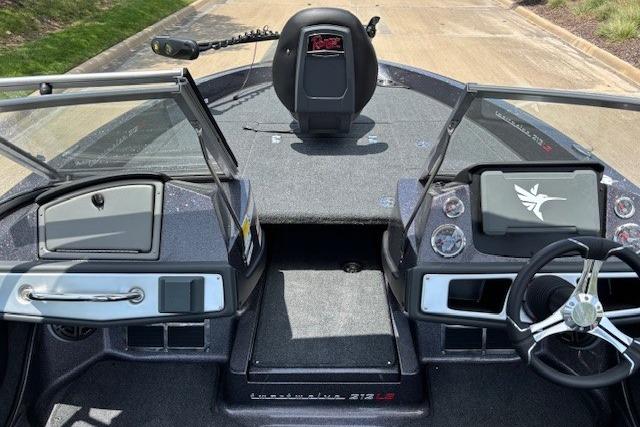 2026 Ranger 212LS boat interior with steering wheel, dashboard, and seating area.