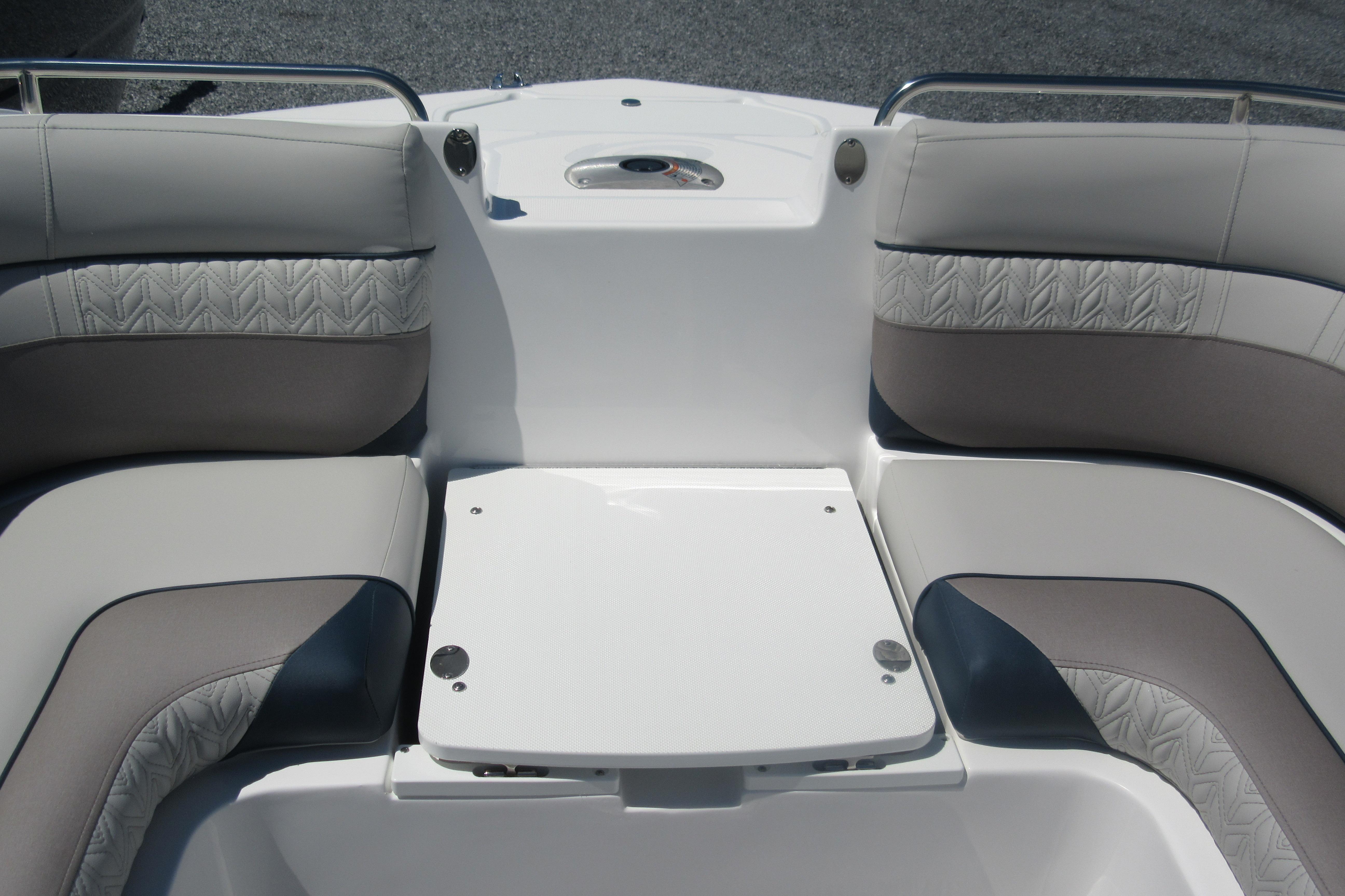Interior seating of 2027 Hurricane SunDeck 2486 OB boat, featuring cushioned upholstery and sleek design.