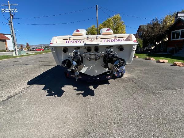2002 Advantage Victory boat on street, rear view, with "Happy Ending" text.