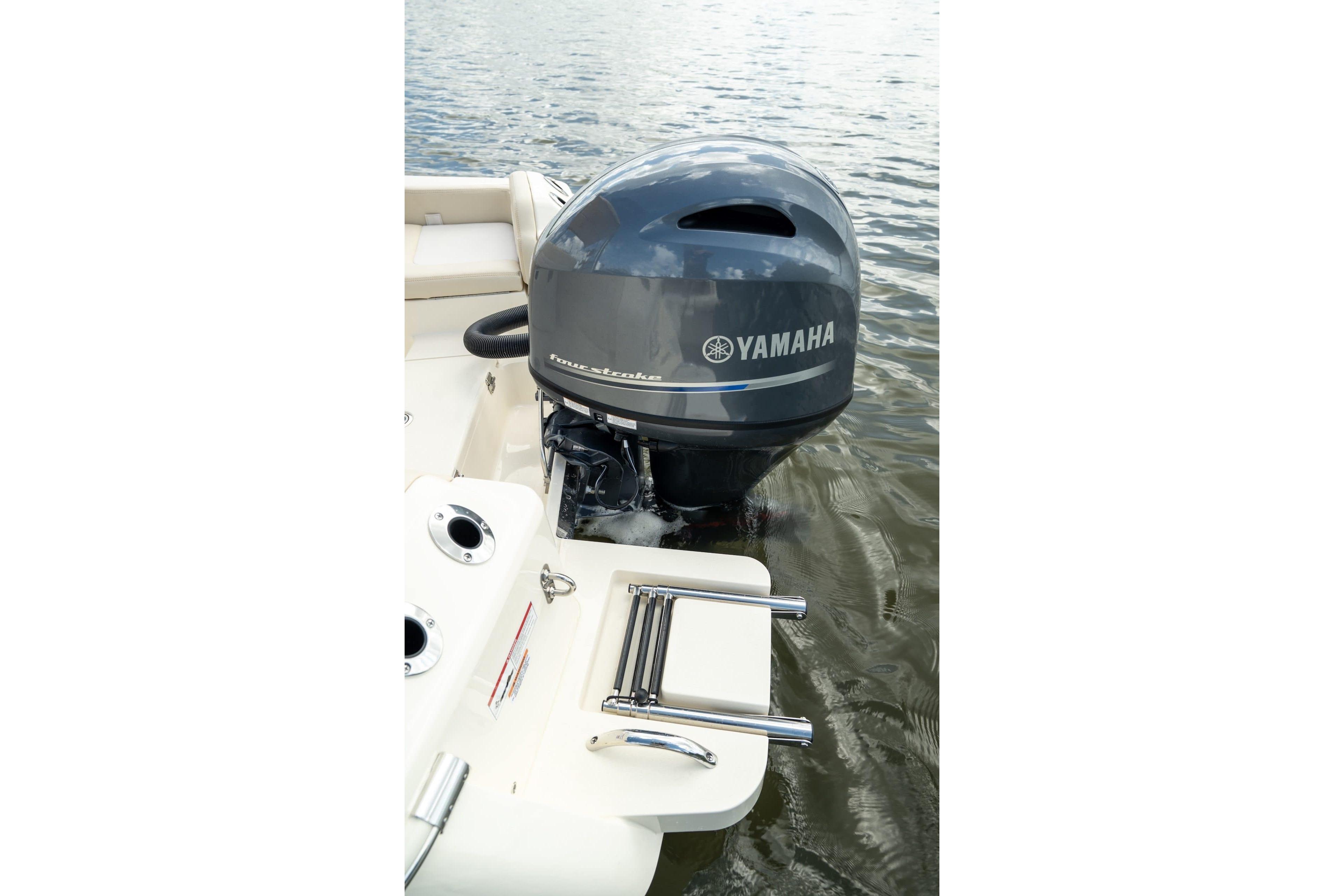 2026 Scout 188 Sportfish with Yamaha outboard motor on calm water.