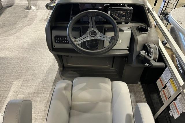 2026 Sun Tracker SportFish 20 DLX boat interior with steering wheel and control panel.
