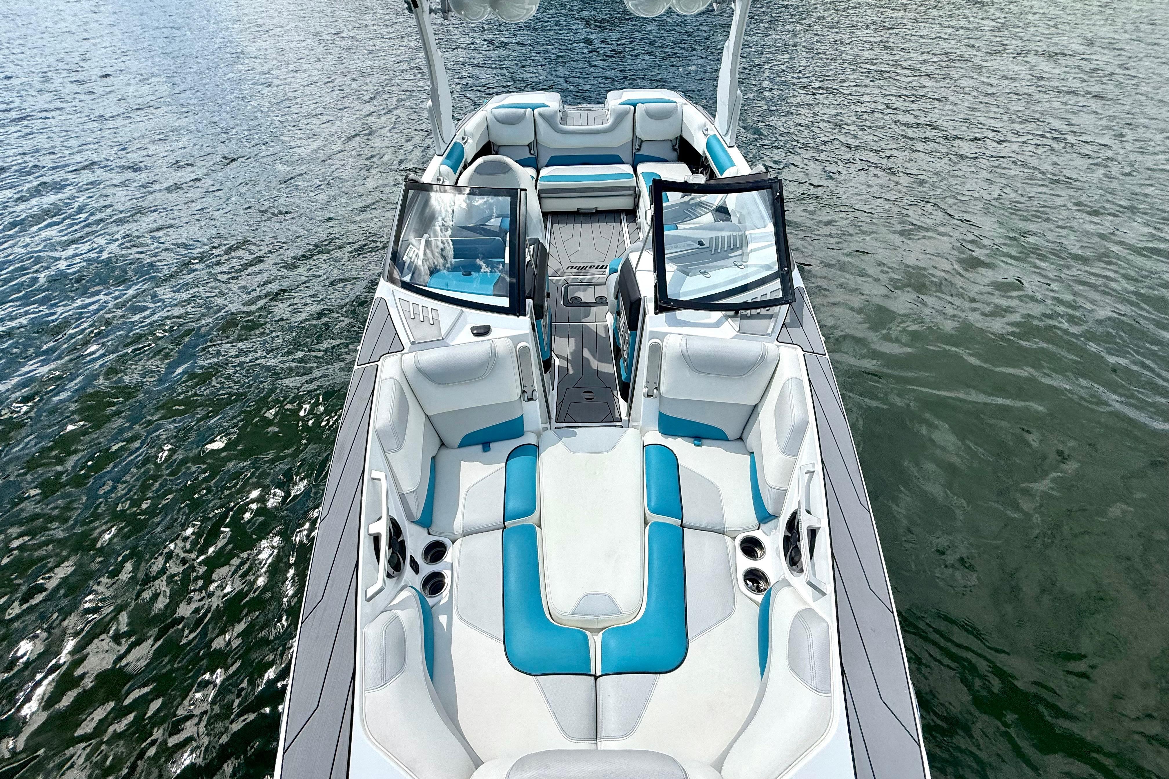 2017 Malibu M235 boat with blue and white interior on water.