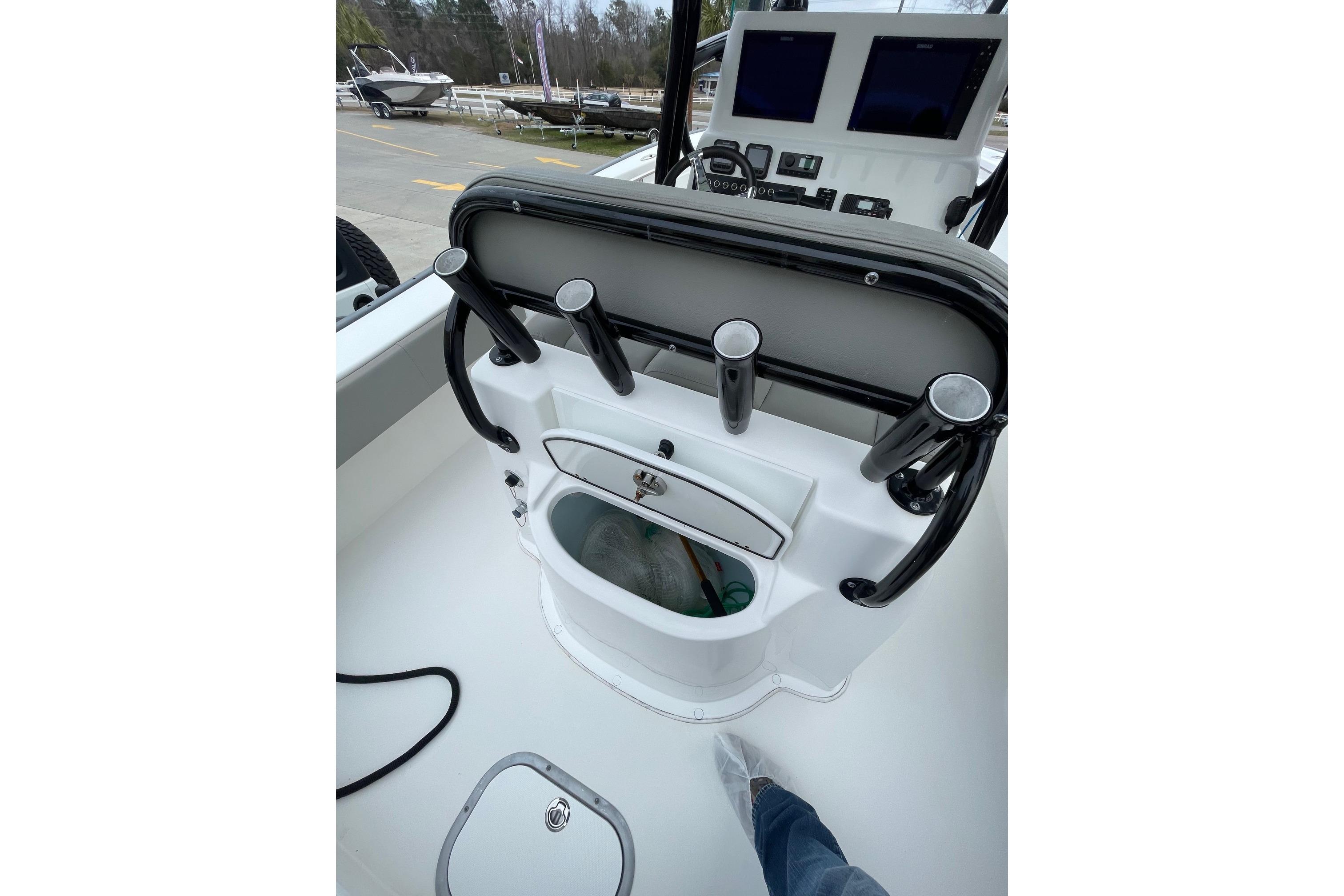 2023 Cape Horn 24 XS boat console with rod holders and navigation screens.
