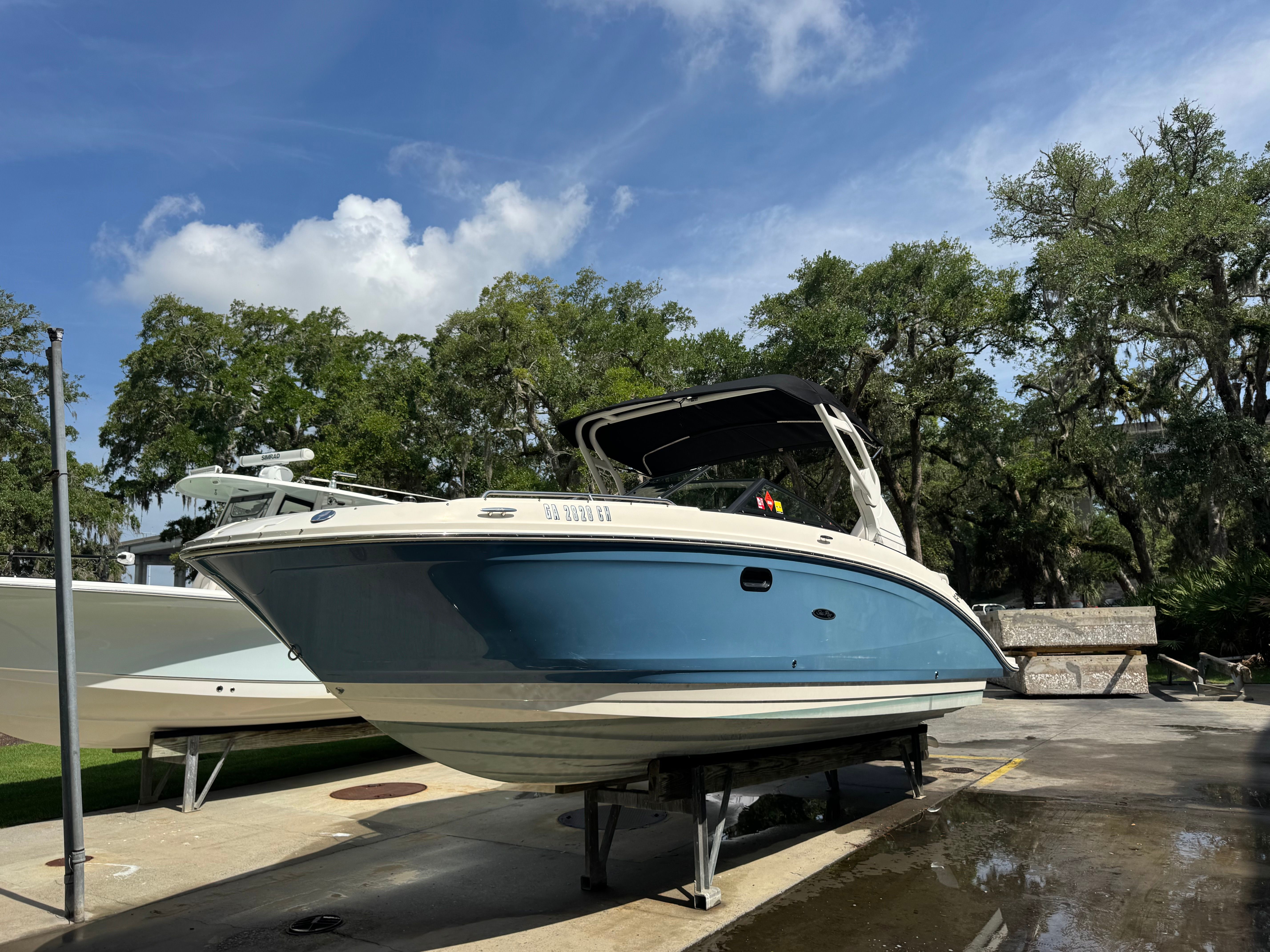 2020 Sea Ray SDX 270 Outboard on a boat lift.