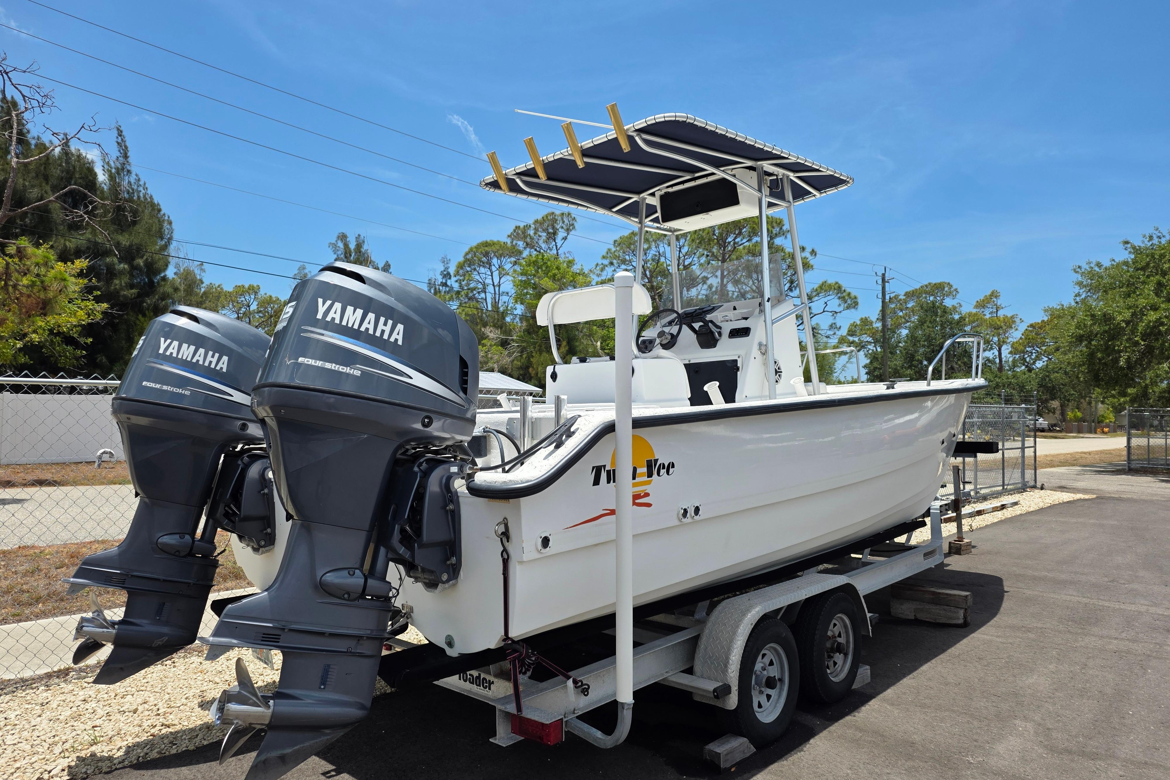 1999 Twin Vee Awesome 22 boat with dual Yamaha engines on a trailer.