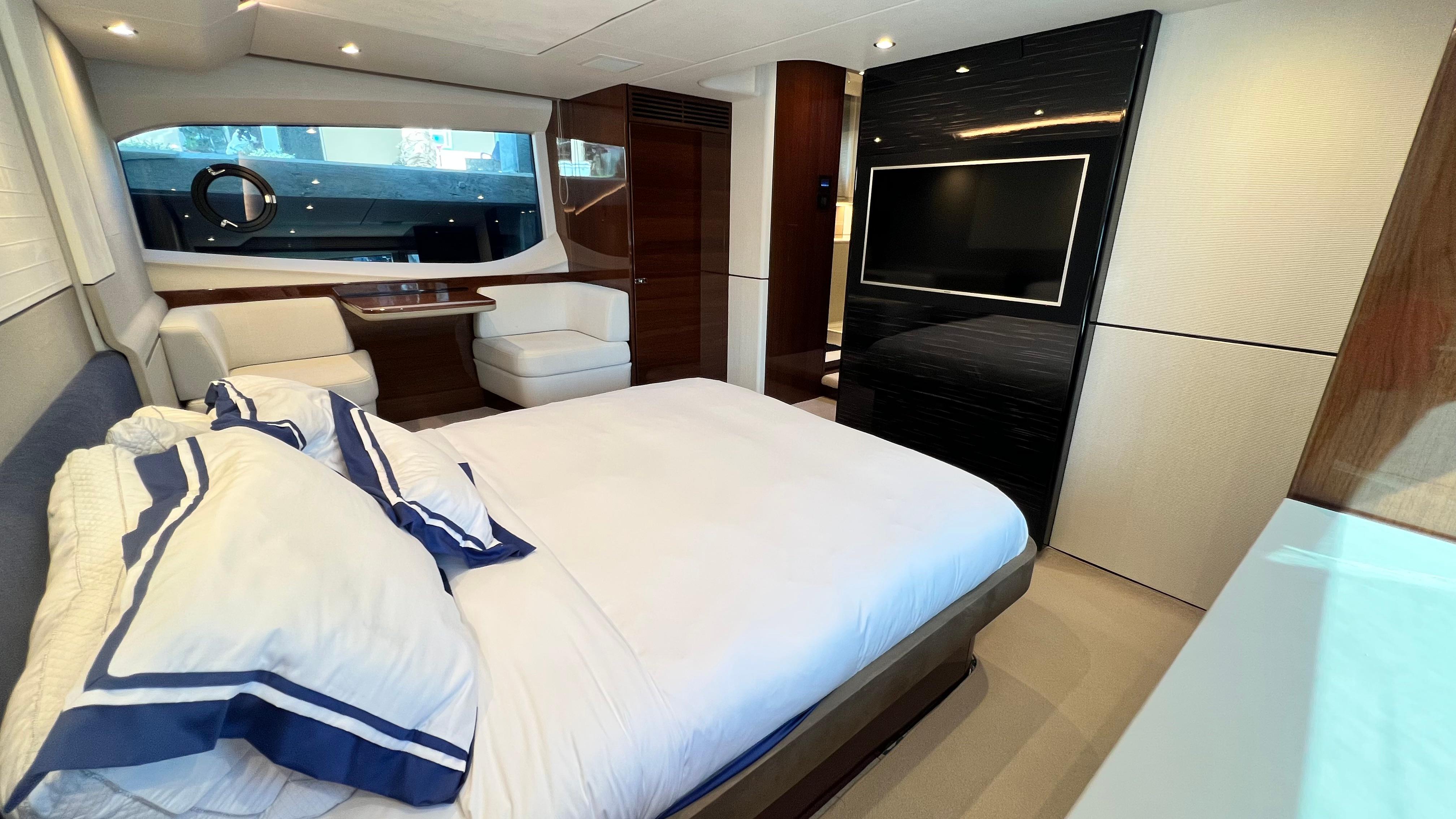 Luxurious 2019 Princess F62 yacht bedroom with elegant decor and modern amenities.