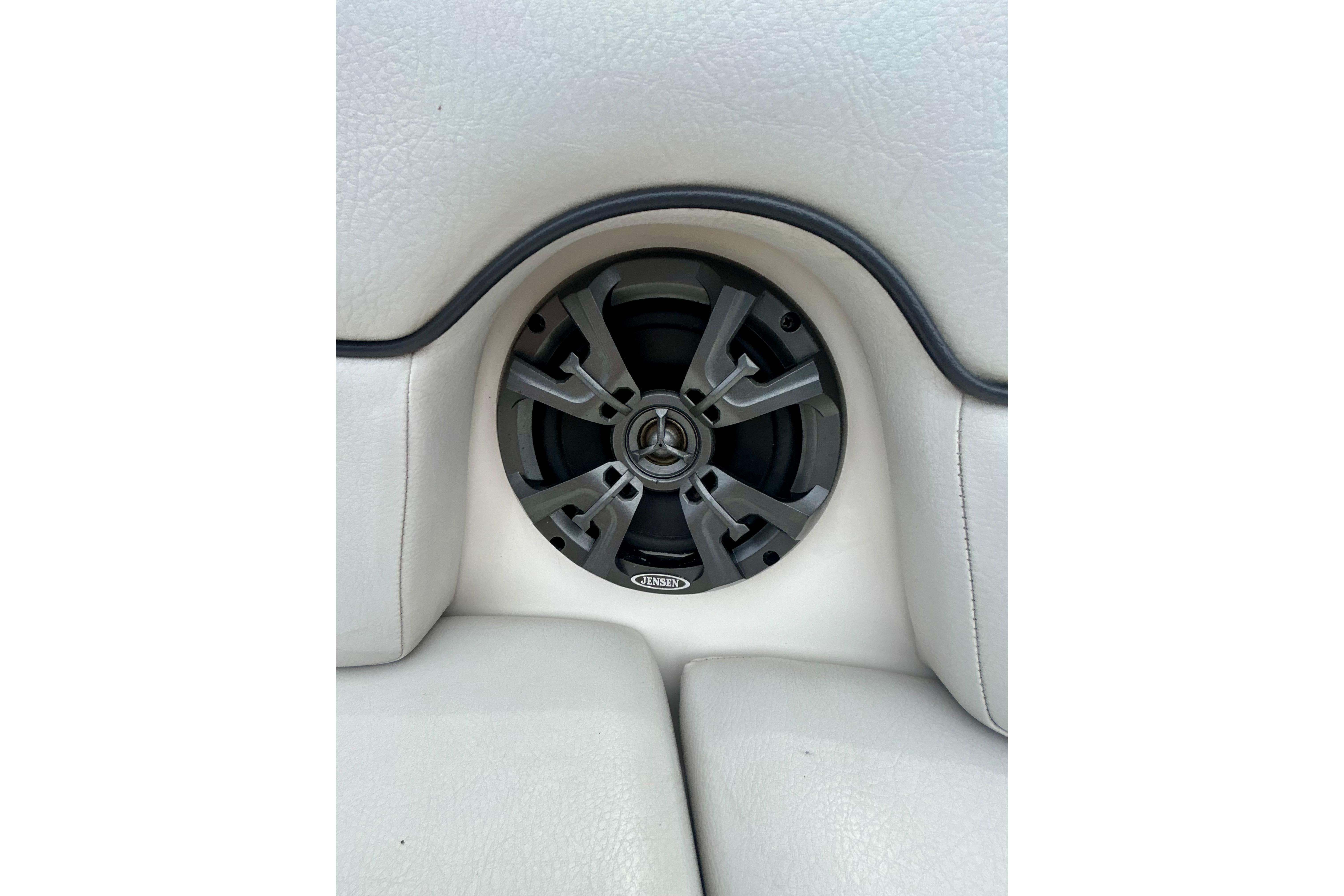 Speaker system in 2015 Yamaha Boats AR210, integrated into white cushioned seating.