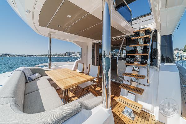 Luxurious Sunseeker Manhattan 68 yacht deck with seating and stairs, 2025 model.