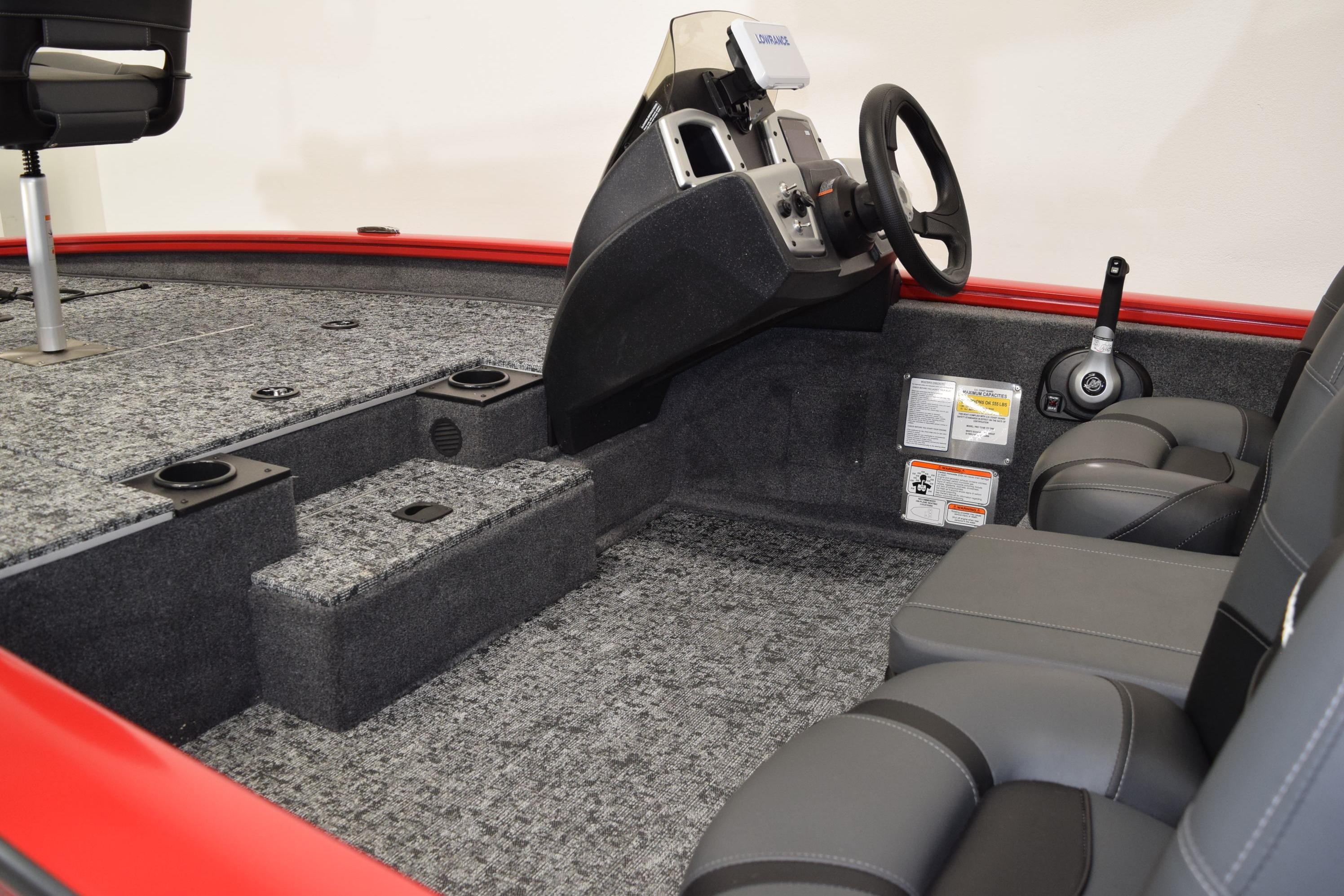 2026 Tracker Pro Team 175 boat interior with steering console and seating.