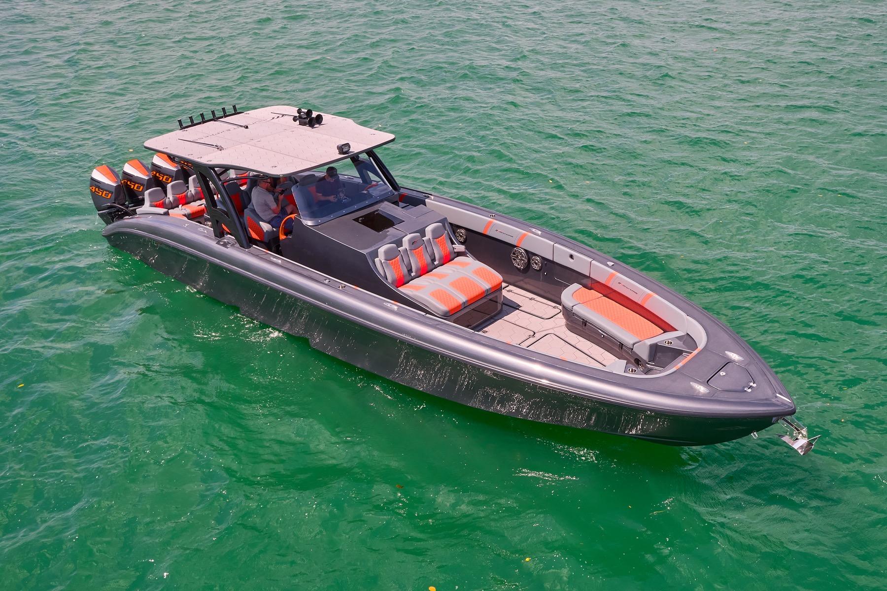 2022 Midnight Express 43 Open boat on clear green water, featuring sleek design and powerful engines.