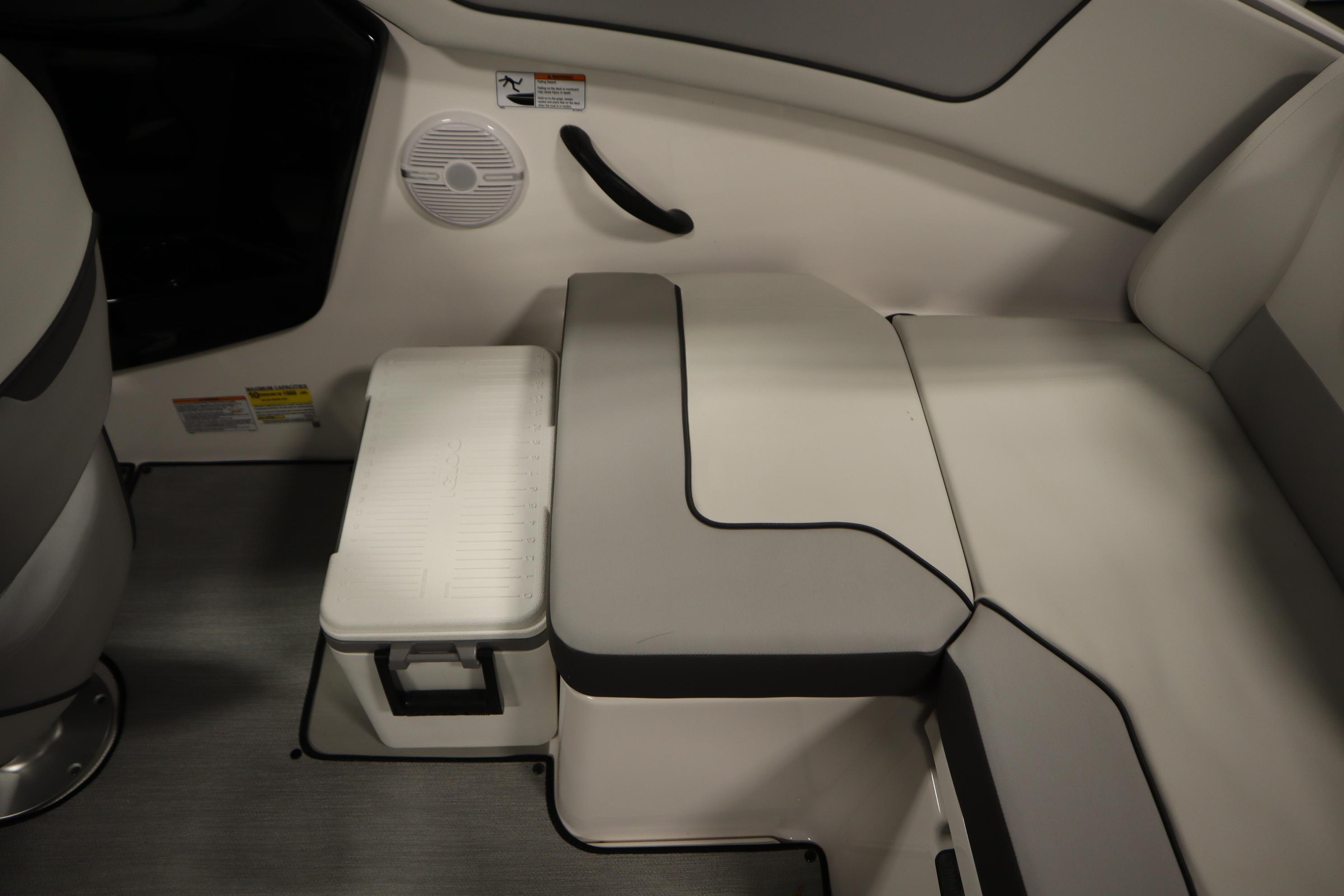 2026 Yamaha Boats AR220 interior seating with integrated storage and speaker.