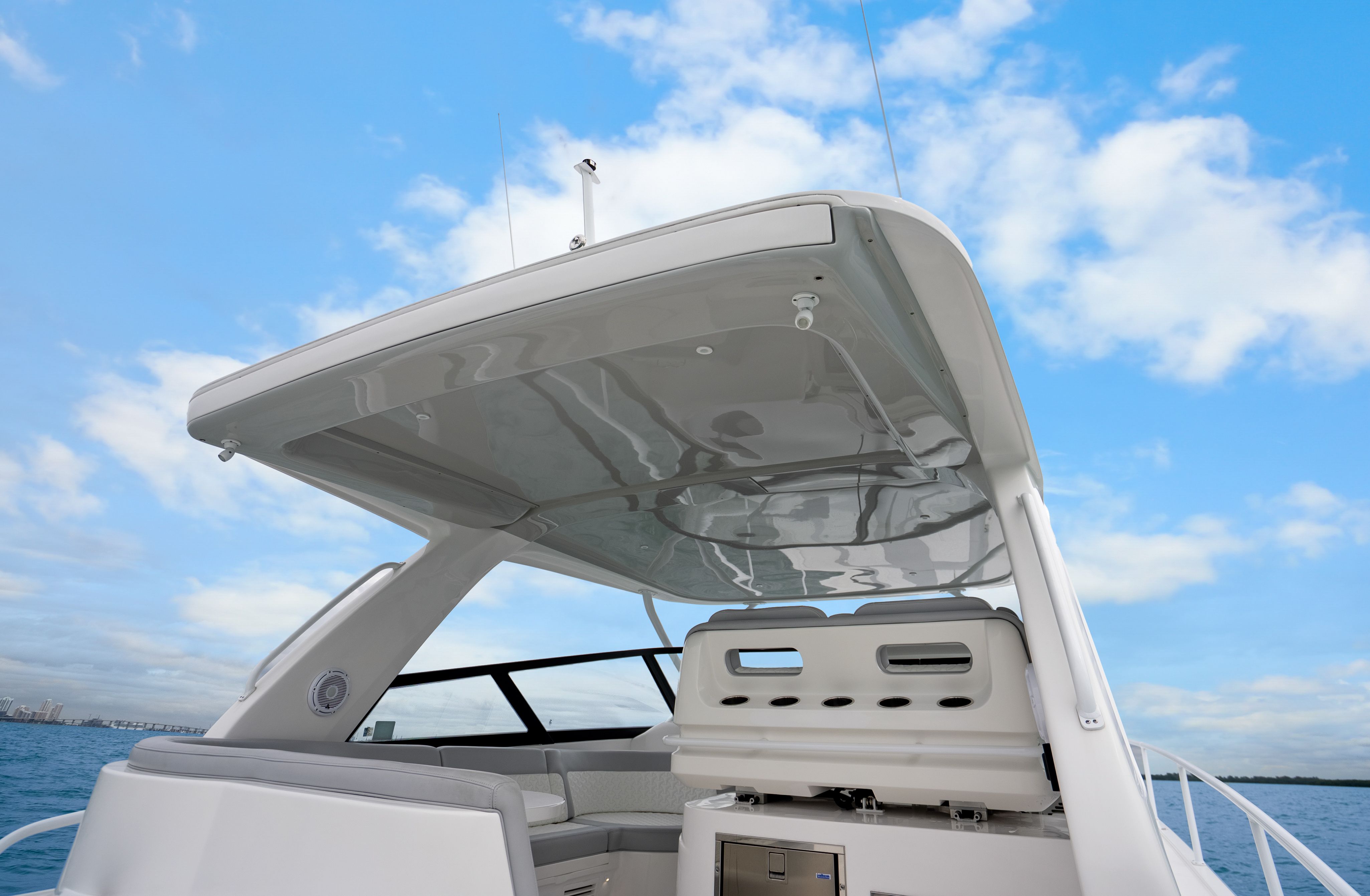 Intrepid 477 Evolution 2024 boat with sleek design and blue sky.