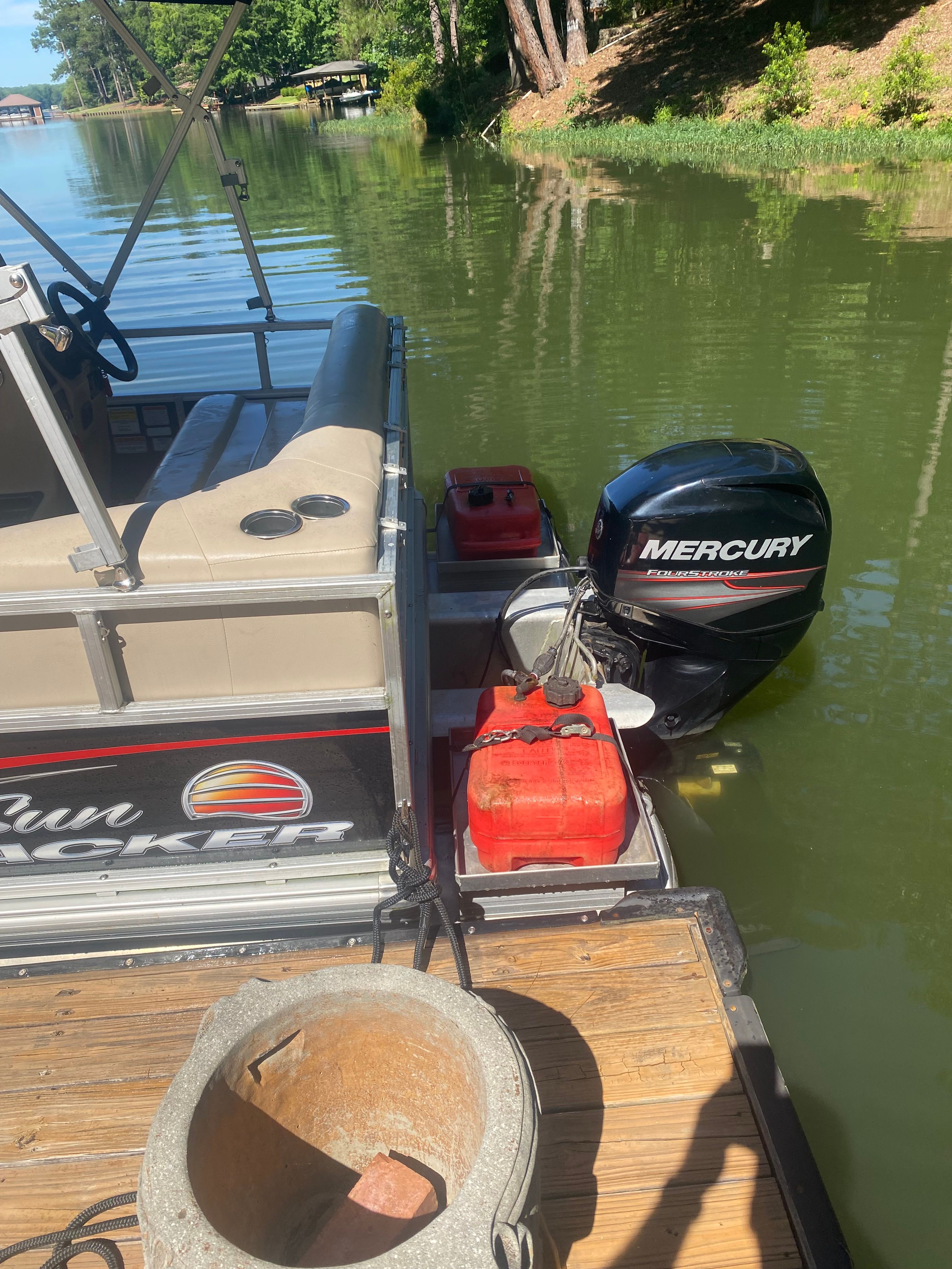 2019 Sun Tracker Bass Buggy 16 DLX with Mercury engine by the lake.
