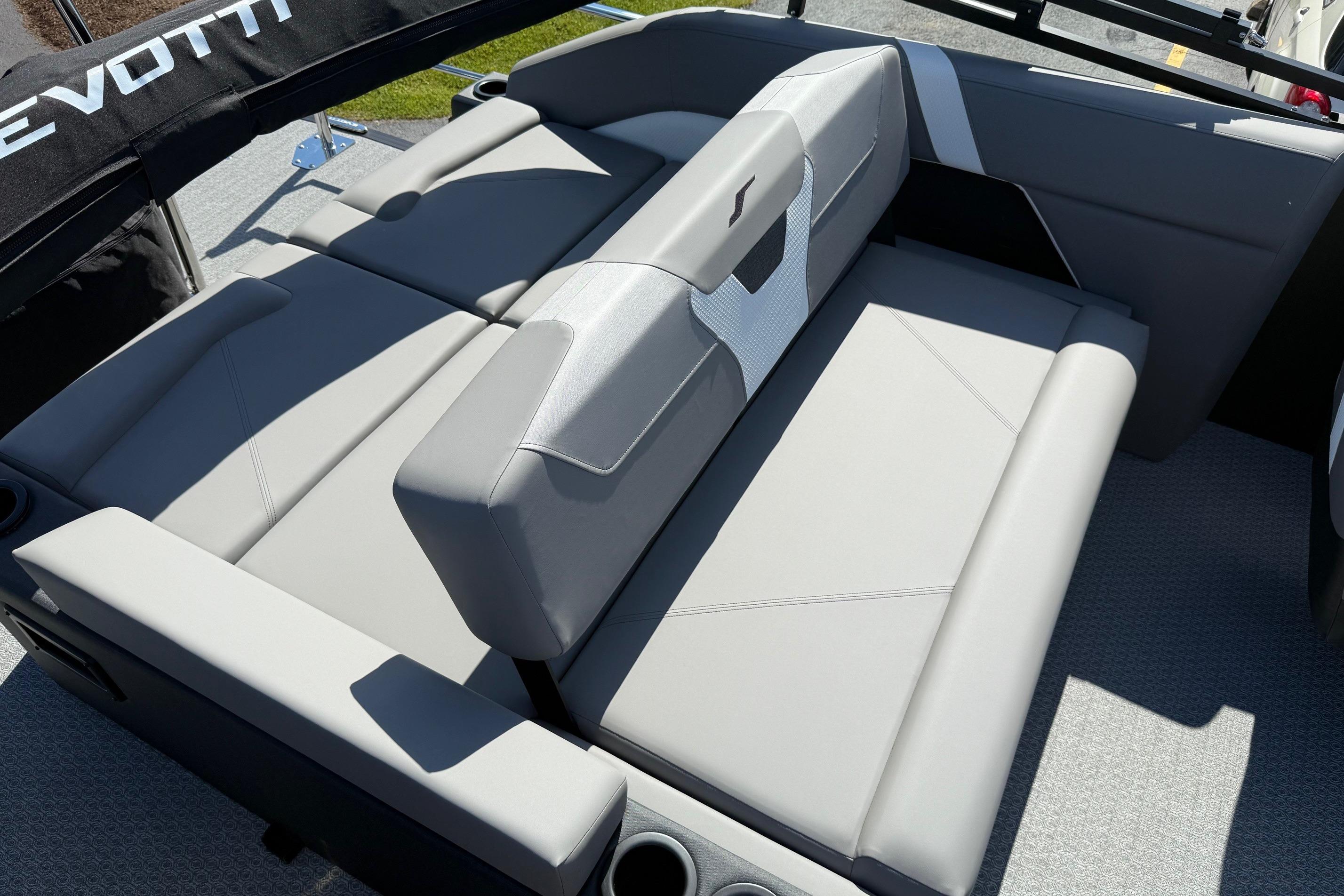 Luxurious seating on 2026 Evotti 521CS boat, featuring sleek gray upholstery and modern design.