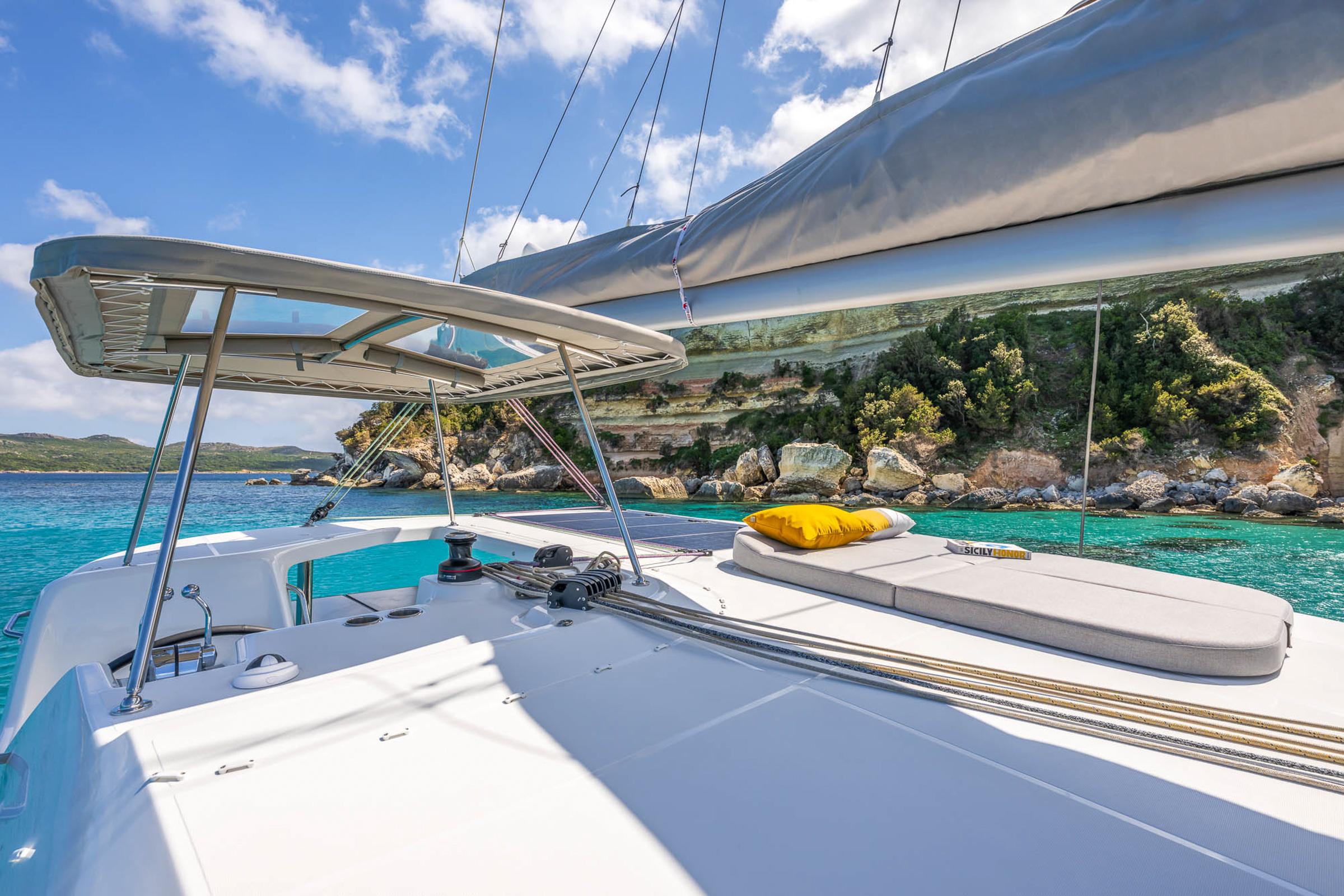 Modern Lagoon 38 catamaran sailing in clear turquoise waters, 2025 model.