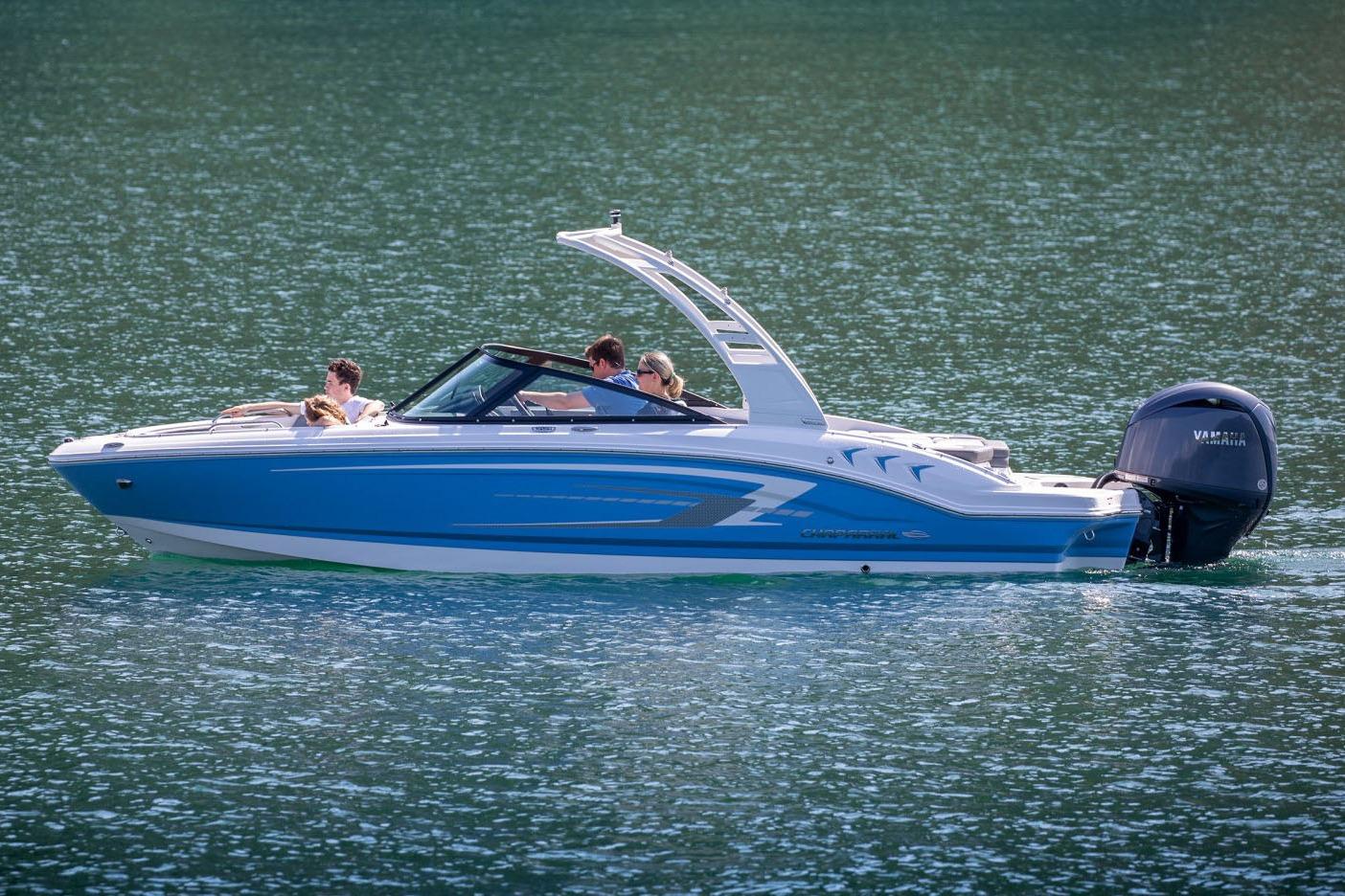 Manufacturer Provided Image: 2026 Chaparral 21 SSi OB boat cruising on a serene lake with passengers.