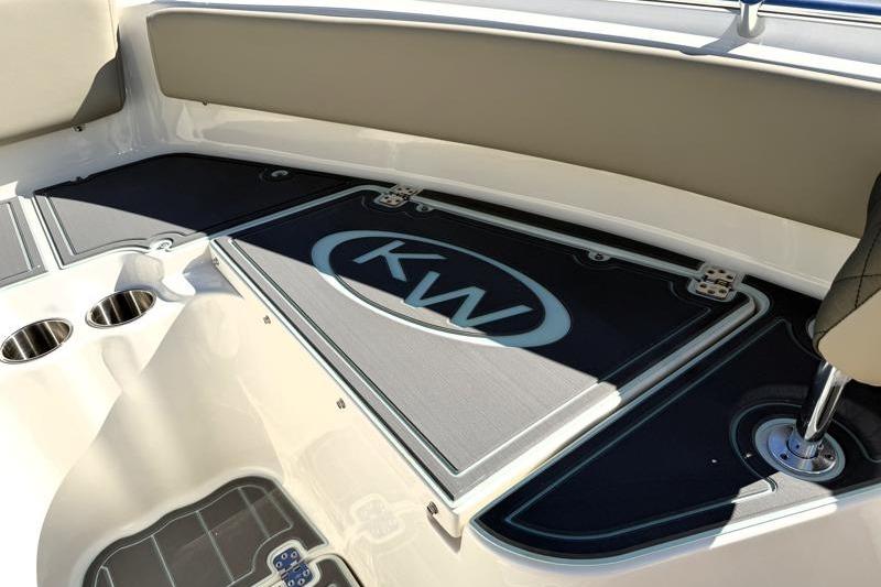 2025 Key West 239 FS boat interior with KW logo and cup holders.