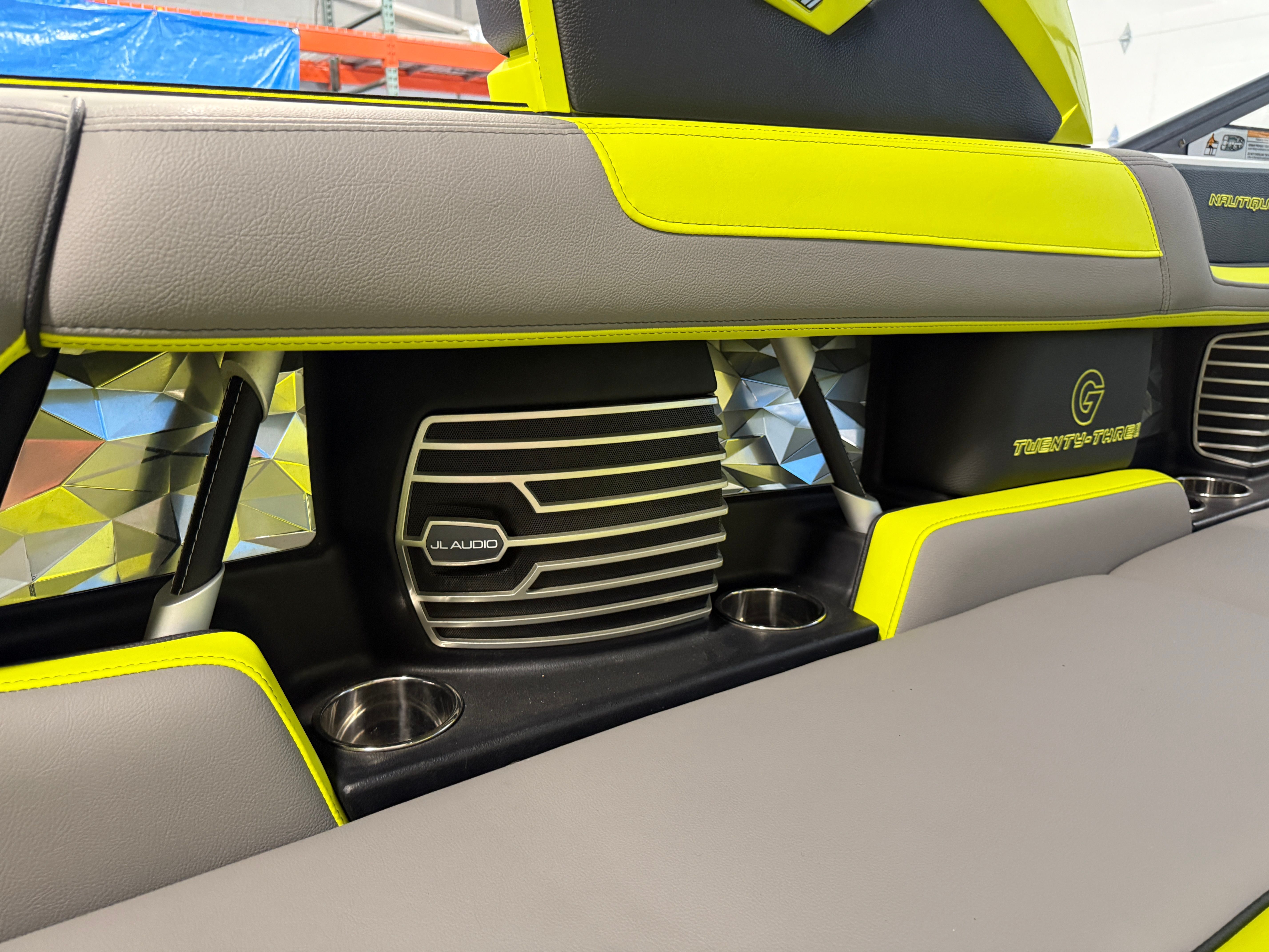 Close-up of a 2016 Nautique Super Air Nautique G23 interior with bright yellow accents.