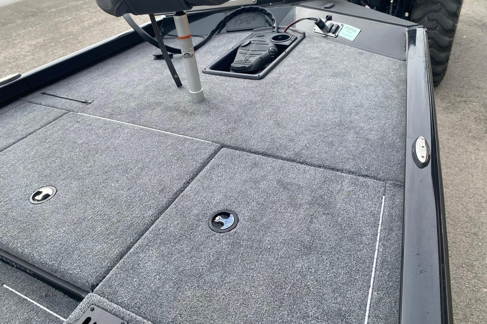 2025 Ranger RT178 boat deck with gray carpet and storage compartments.