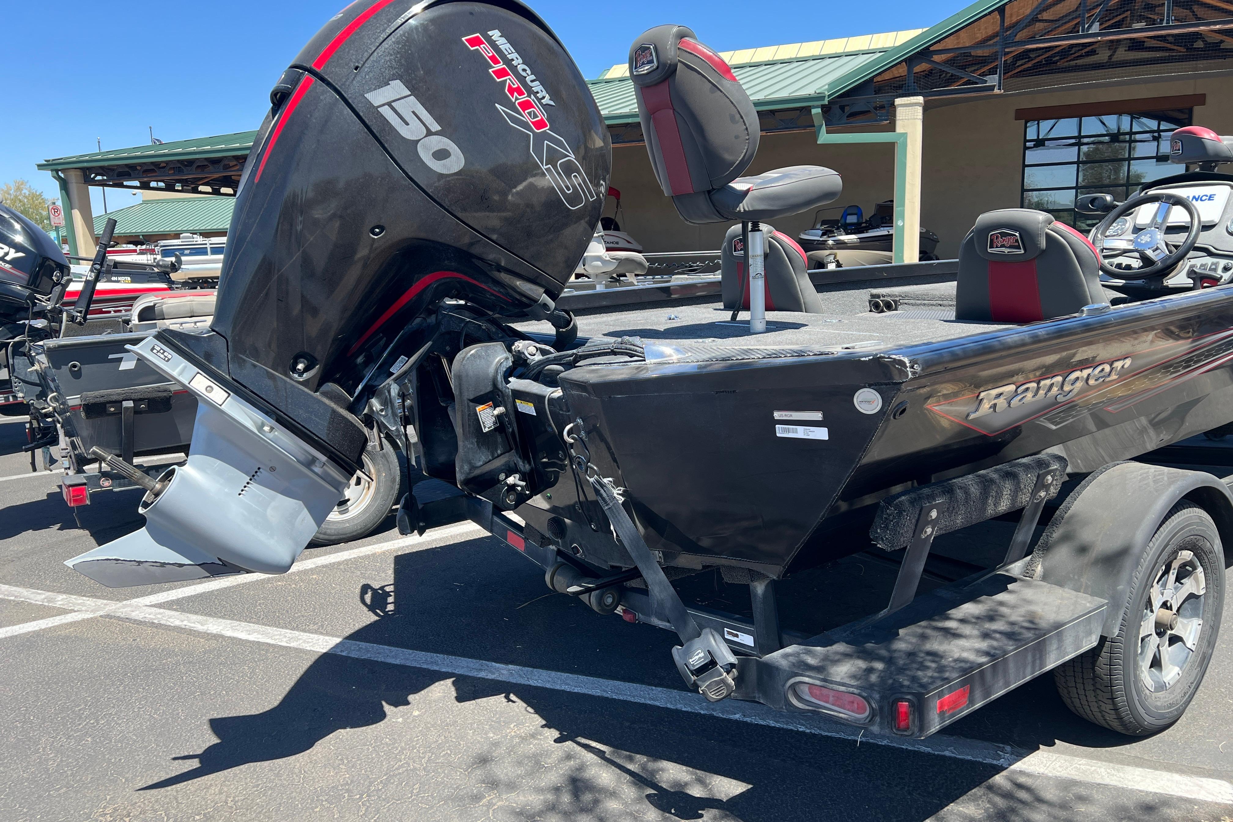 2019 Ranger RT198P boat with Mercury 150 Pro XS engine in parking lot.