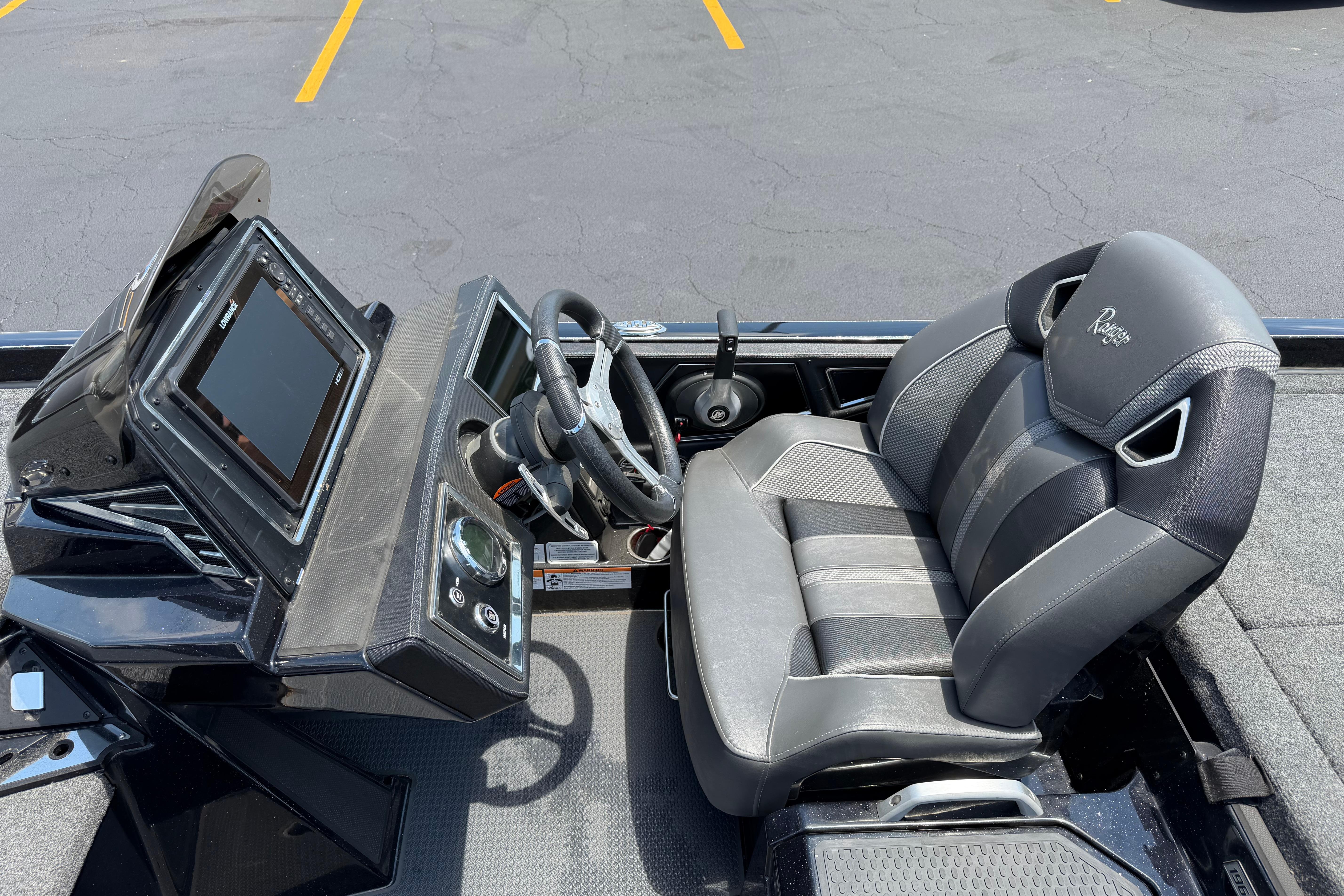 2023 Ranger Z520R boat cockpit with steering wheel and modern dashboard.