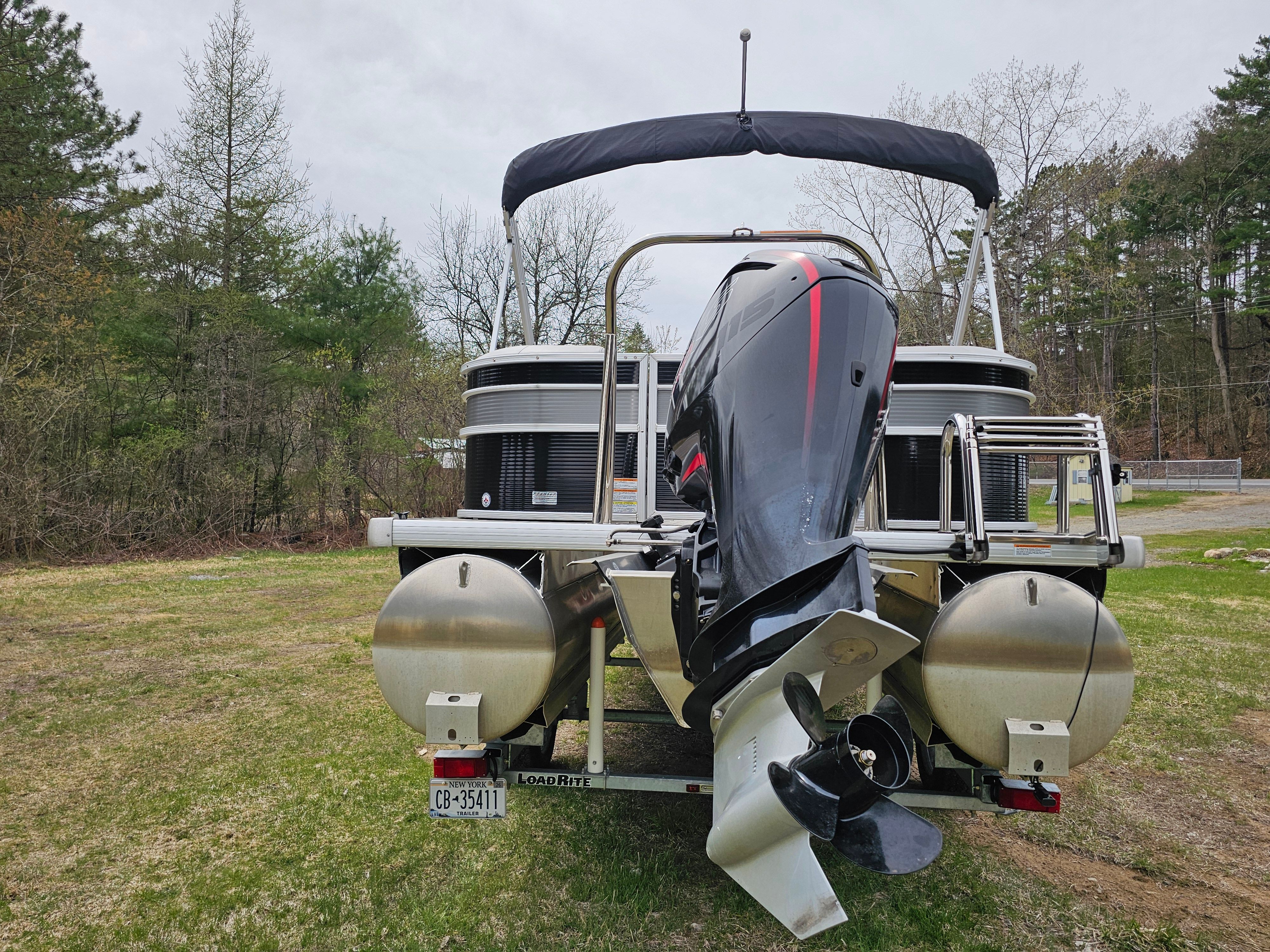 Rear view of a 2021 Princecraft Vectra 23XT pontoon boat on a trailer.