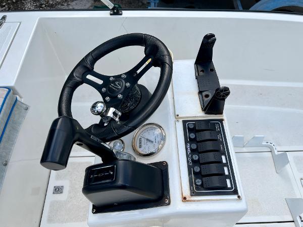 1986 Hoog Comet 14 boat steering console with controls and gauges.