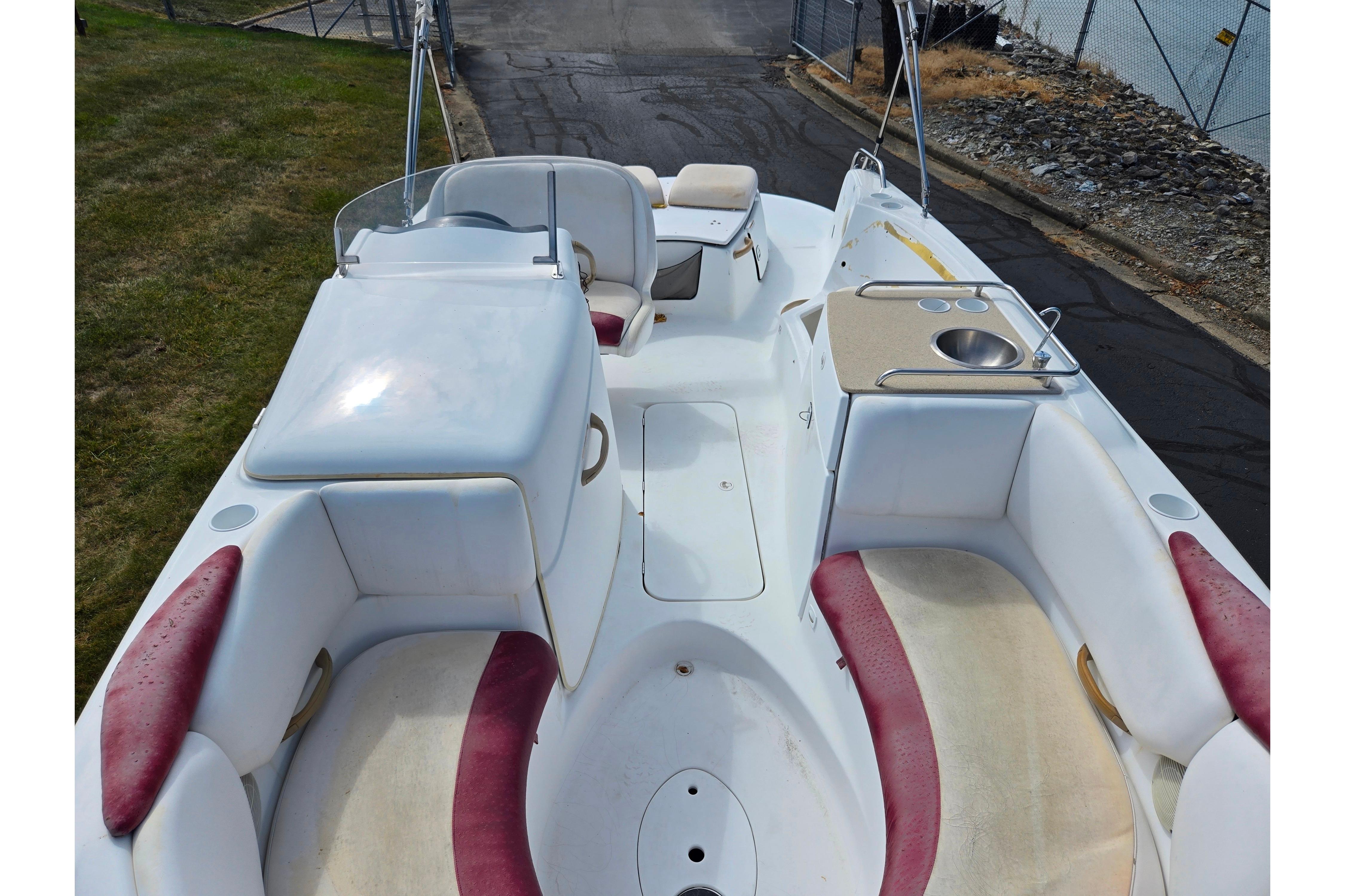 2004 Sea-Doo Islandia boat interior with seating, sink, and storage compartments.