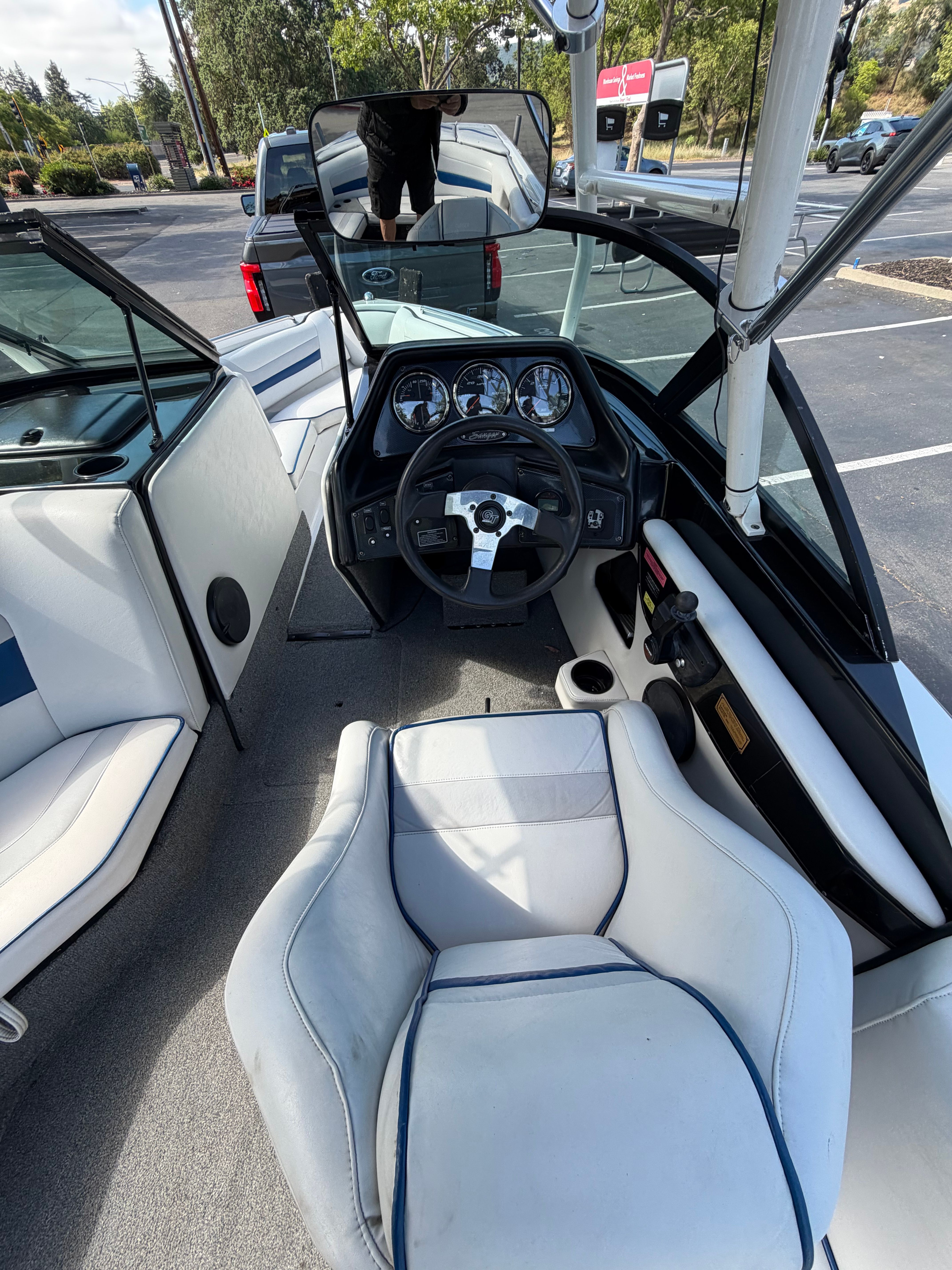 Interior view of a 2001 Sanger V210 with a white seat and dashboard.