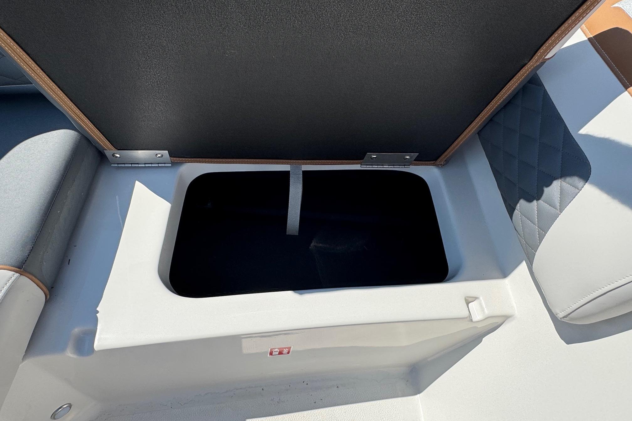 Open storage compartment on 2026 Starcraft SVX 190 OB boat.