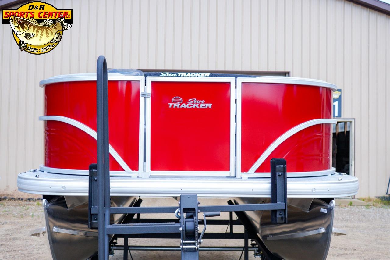 2026 Sun Tracker Party Barge 16 pontoon boat with vibrant red exterior.