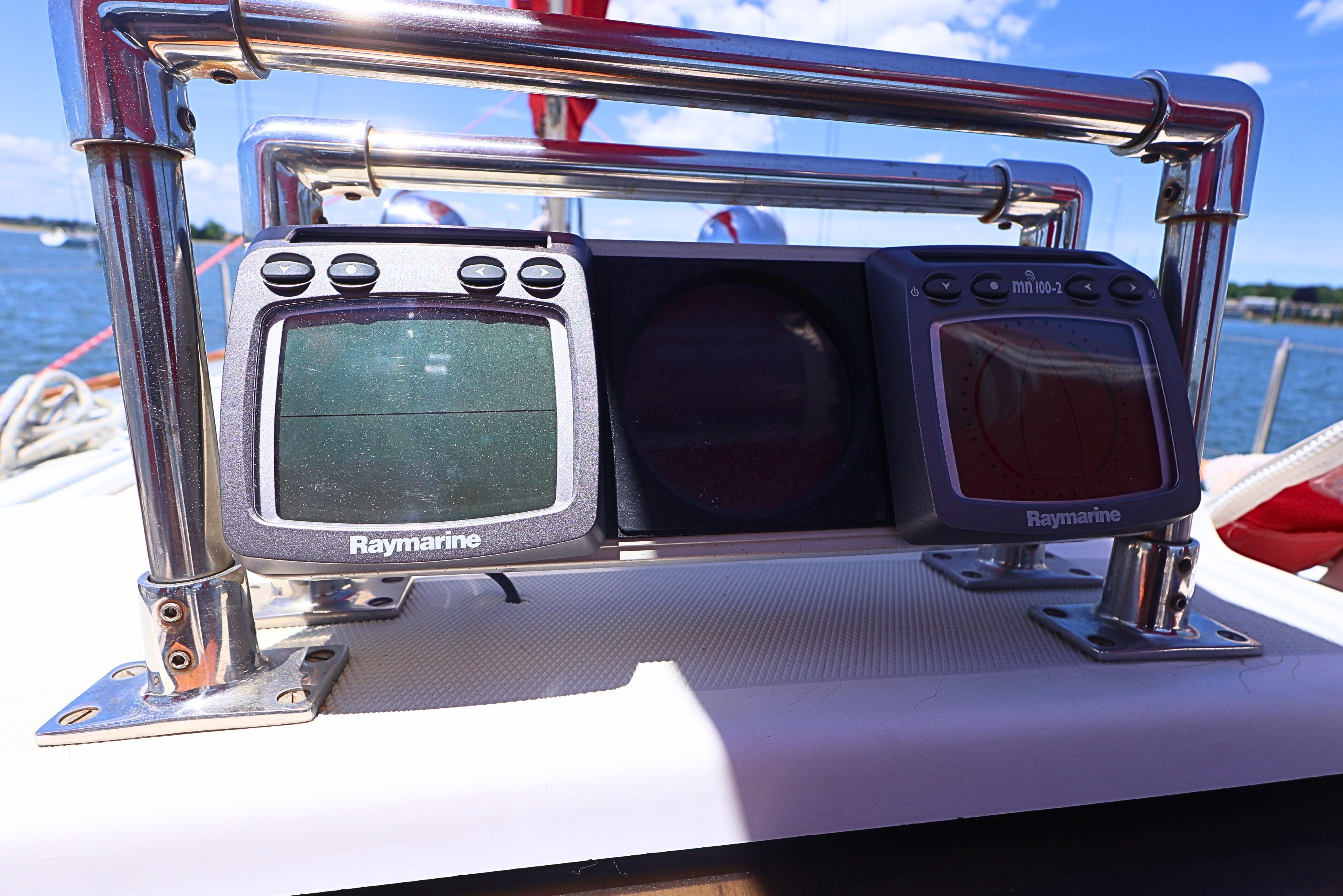 Raymarine navigation instruments on a 1989 J Boat J 40, with a scenic water backdrop.
