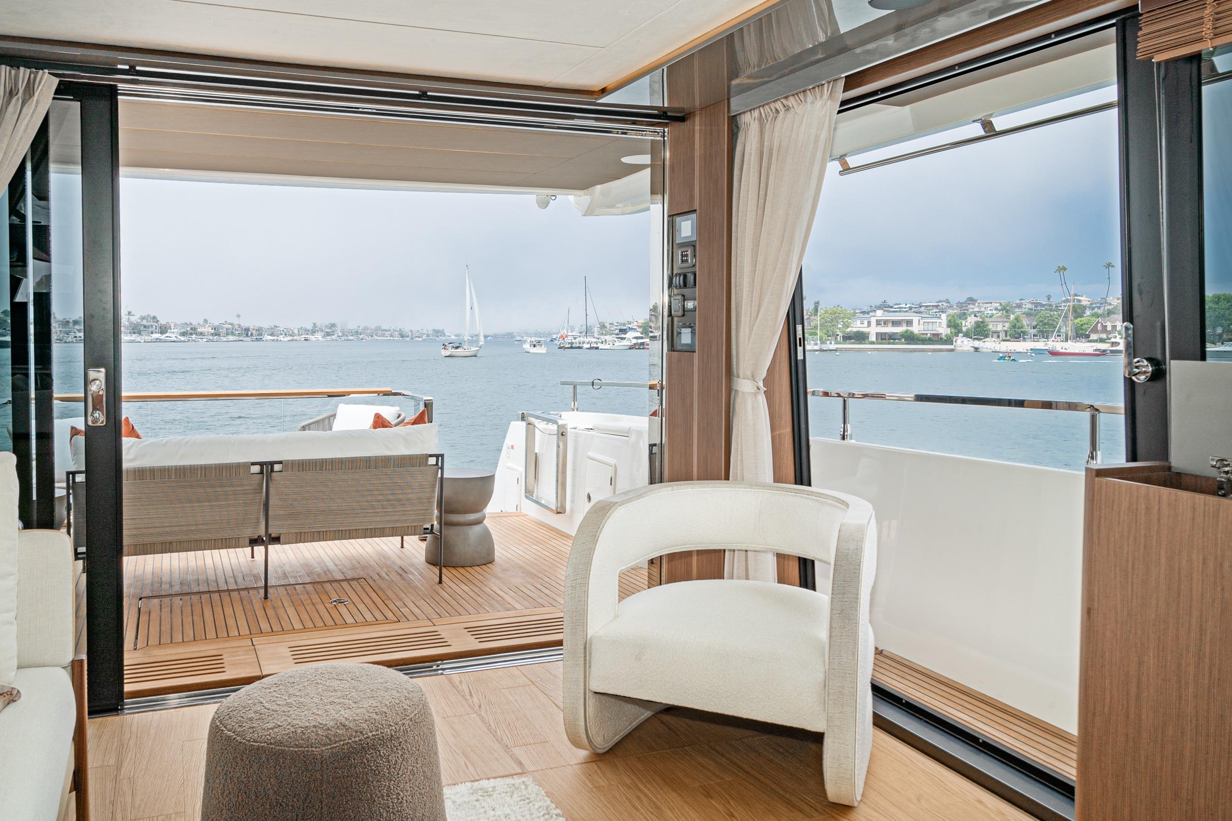 Luxurious interior of 2024 Prestige X60 yacht with scenic ocean view.