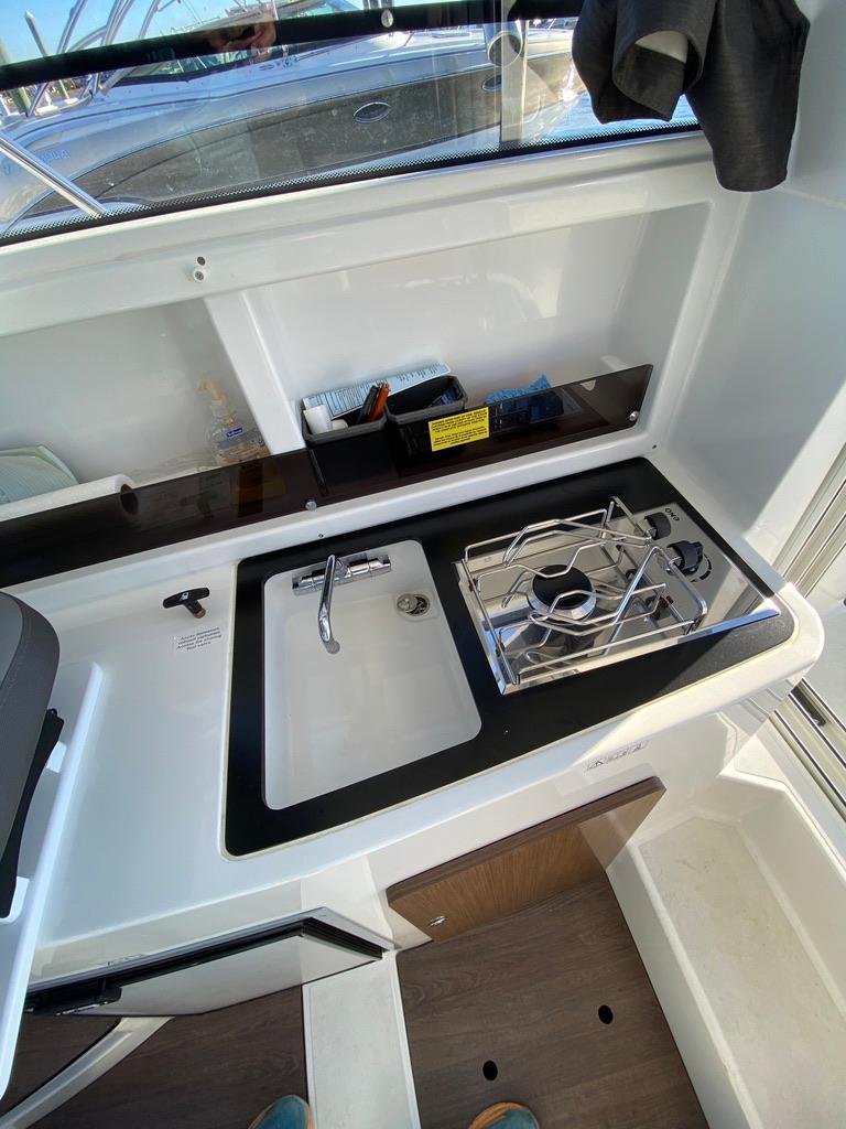 2021 Beneteau Antares 23 boat kitchen with sink and stove