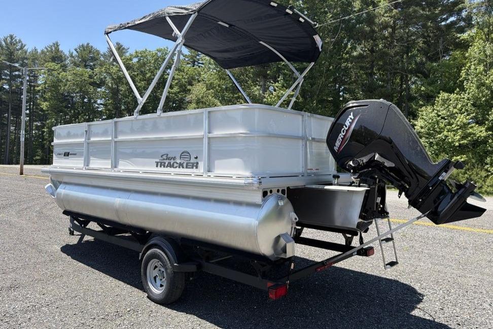 2026 Sun Tracker Party Barge 18 DLX pontoon boat with Mercury outboard motor.